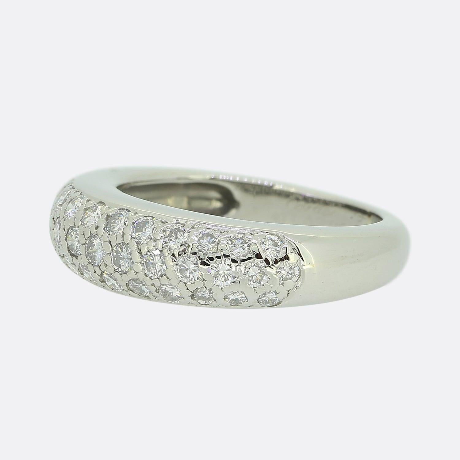 Here we have a timeless diamond ring from the world renowned jewellery house of Cartier. This wonderful piece is made from platinum and displays 3 glittering rows of round brilliant cut diamonds. Forty diamonds collectively create this dazzling
