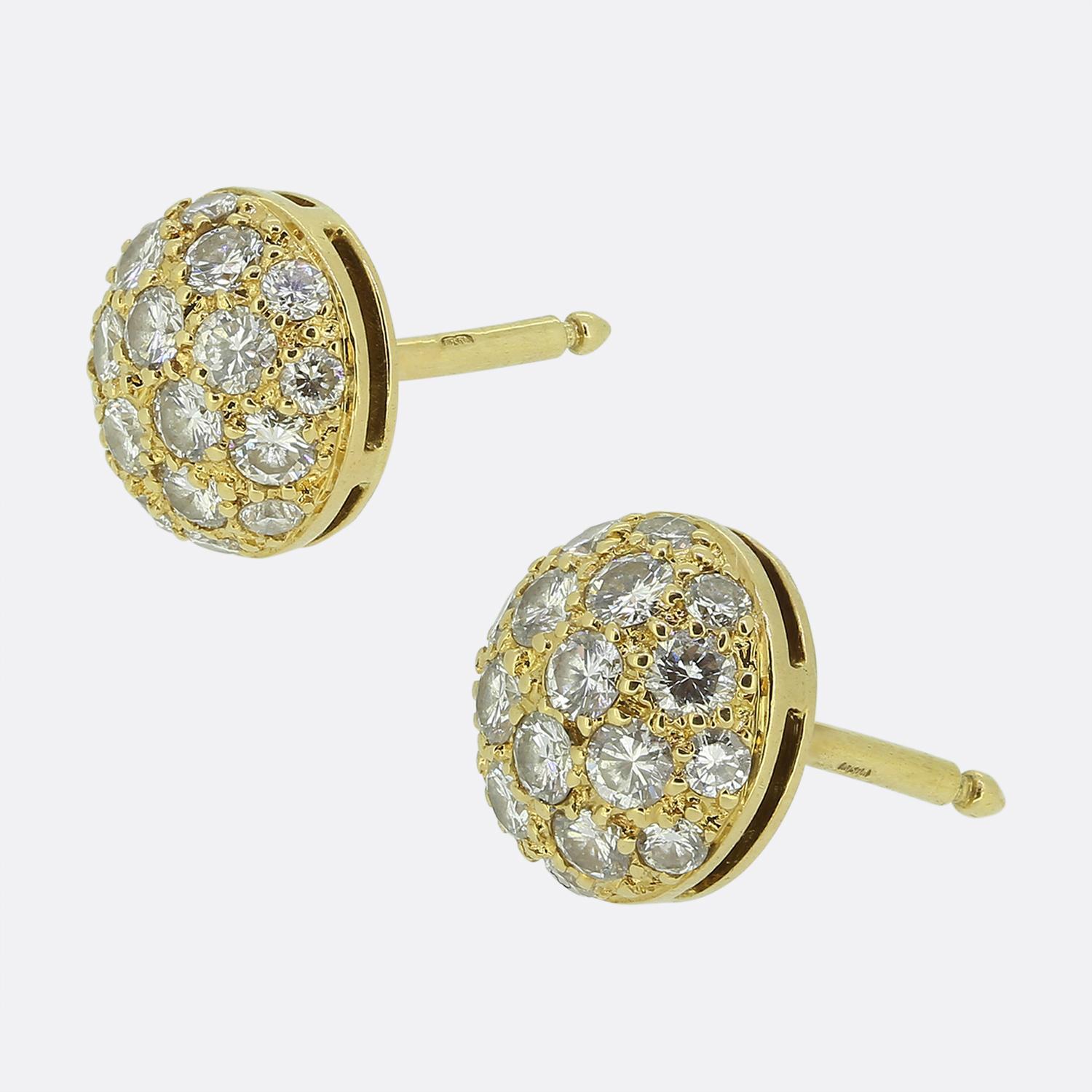Here we have a stunning pair of stud earrings from the world renowned luxury jewellery house of Cartier. Each identical piece has been crafted from a rich 18ct yellow gold into a rounded dome shape and beautifully set with a scintillating array of