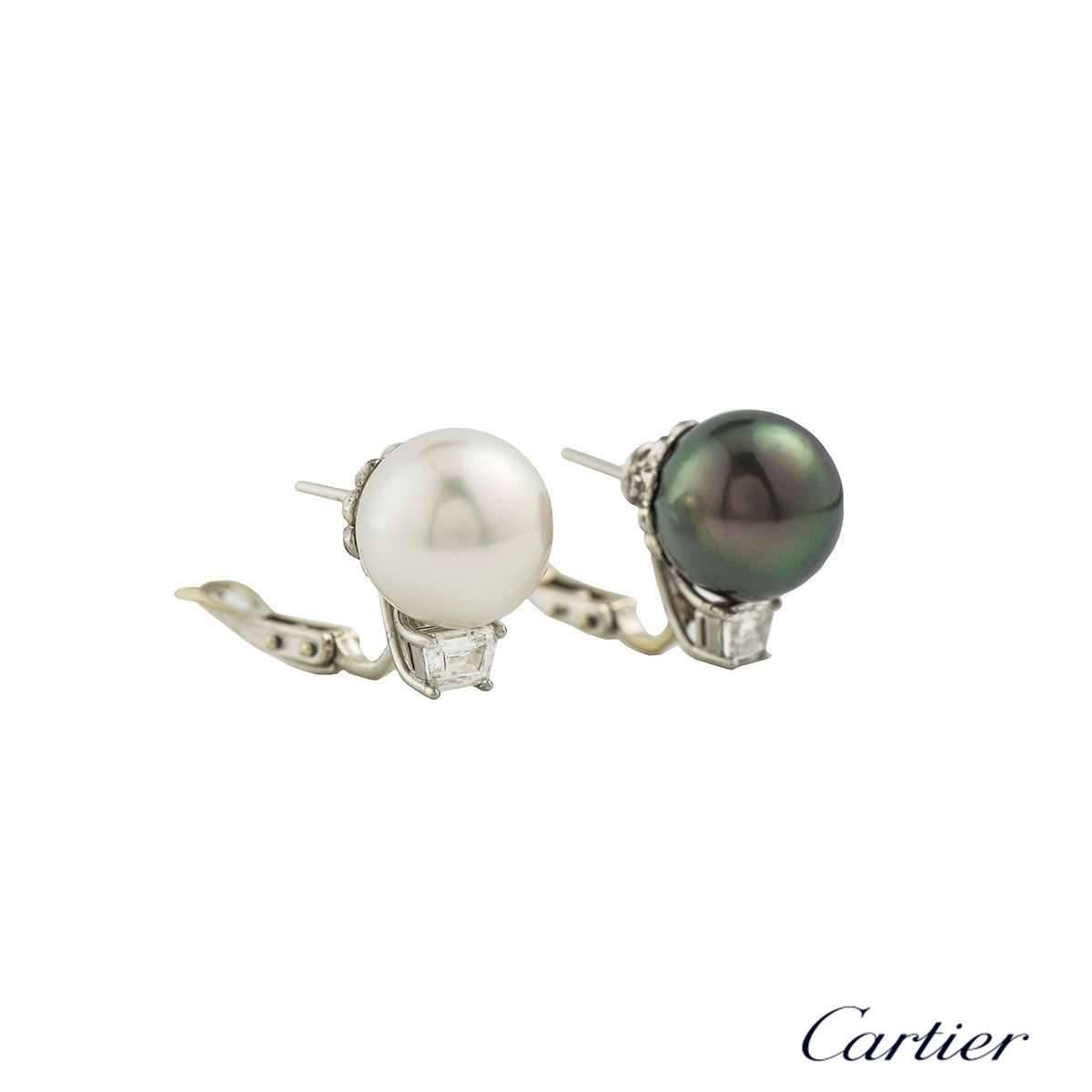 A beautiful pair of Cartier pearl and diamond earrings in Platinum. The earrings are composed of 1 tahitian pearl and 1 south sea pearl finished off with a trapezoid diamond each. The diamonds are an approximate weight of 0.60ct, G+ colour and VS+