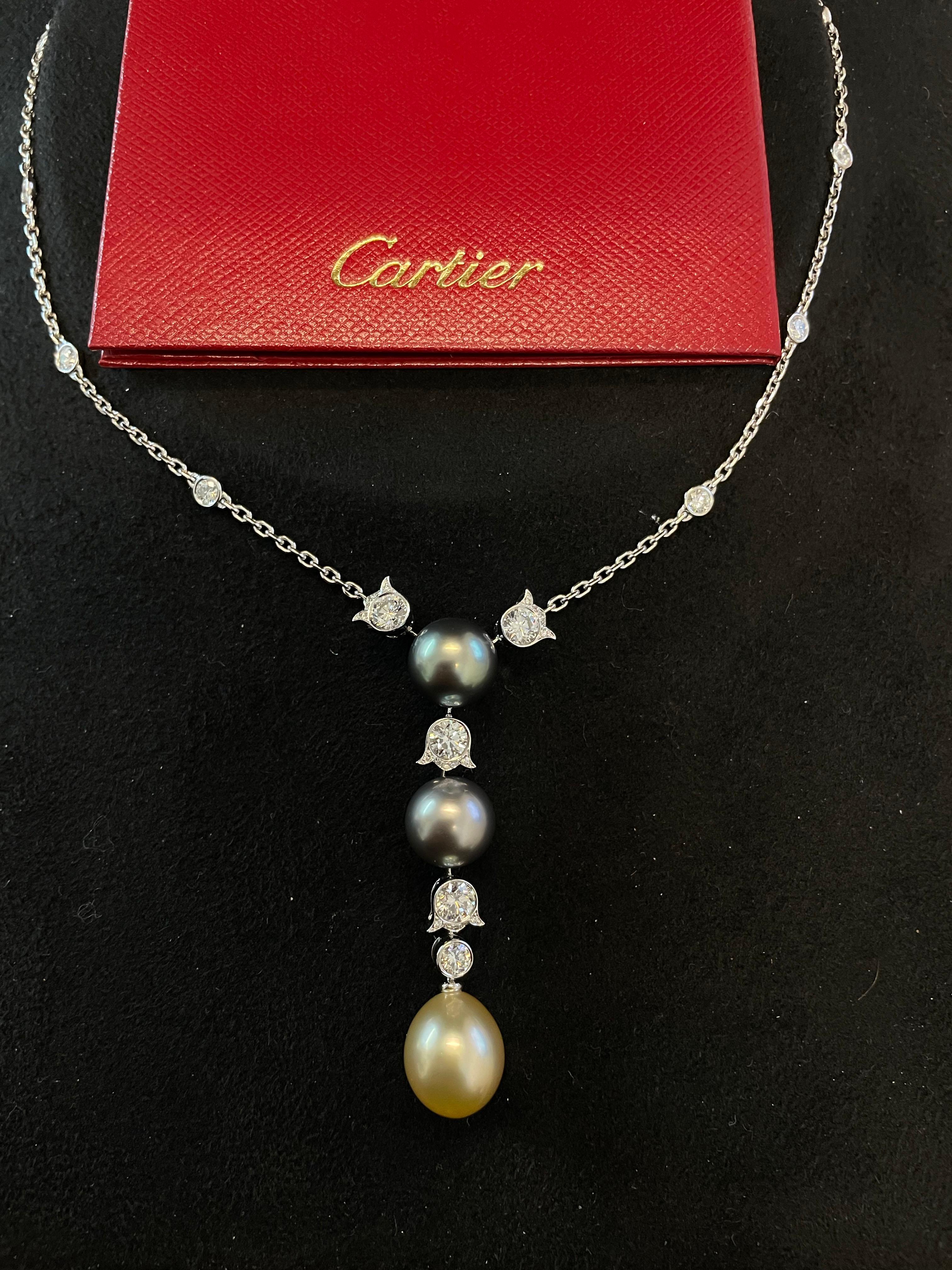 Item Details: This stunning Cartier necklace has three pearls and diamonds in a station design. This necklace contains its original box and certificate.

Circa: 1990s
Metal Type: 18 karat white gold
Weight: 16.4g
Length: approximately 17