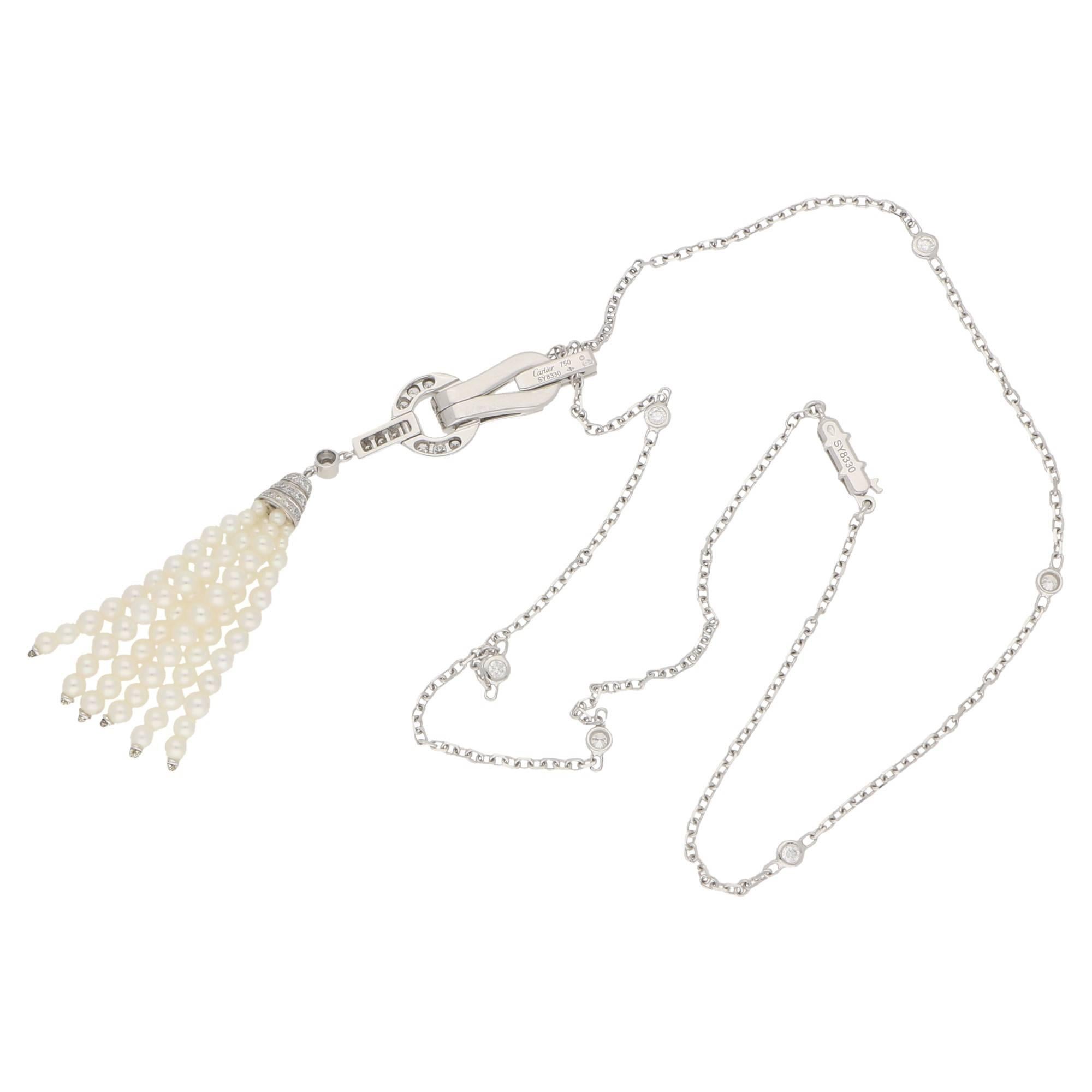 An elegant Cartier 1920's inspired diamond and pearl tassel pendant and necklace. Set in 18ct white gold the Art Deco design offers brilliant-cut diamonds totaling approximately 1.5cts atop a cultured pearl tassel drop pendant. The 18ct white gold