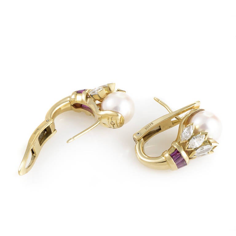 The enduring quality of this glamorous pair of earrings from Cartier is without comparison. The earrings are made of 18K yellow gold and are each set with a single white pearl. Lastly, marquise-cut diamonds and baguette-cut rubies.