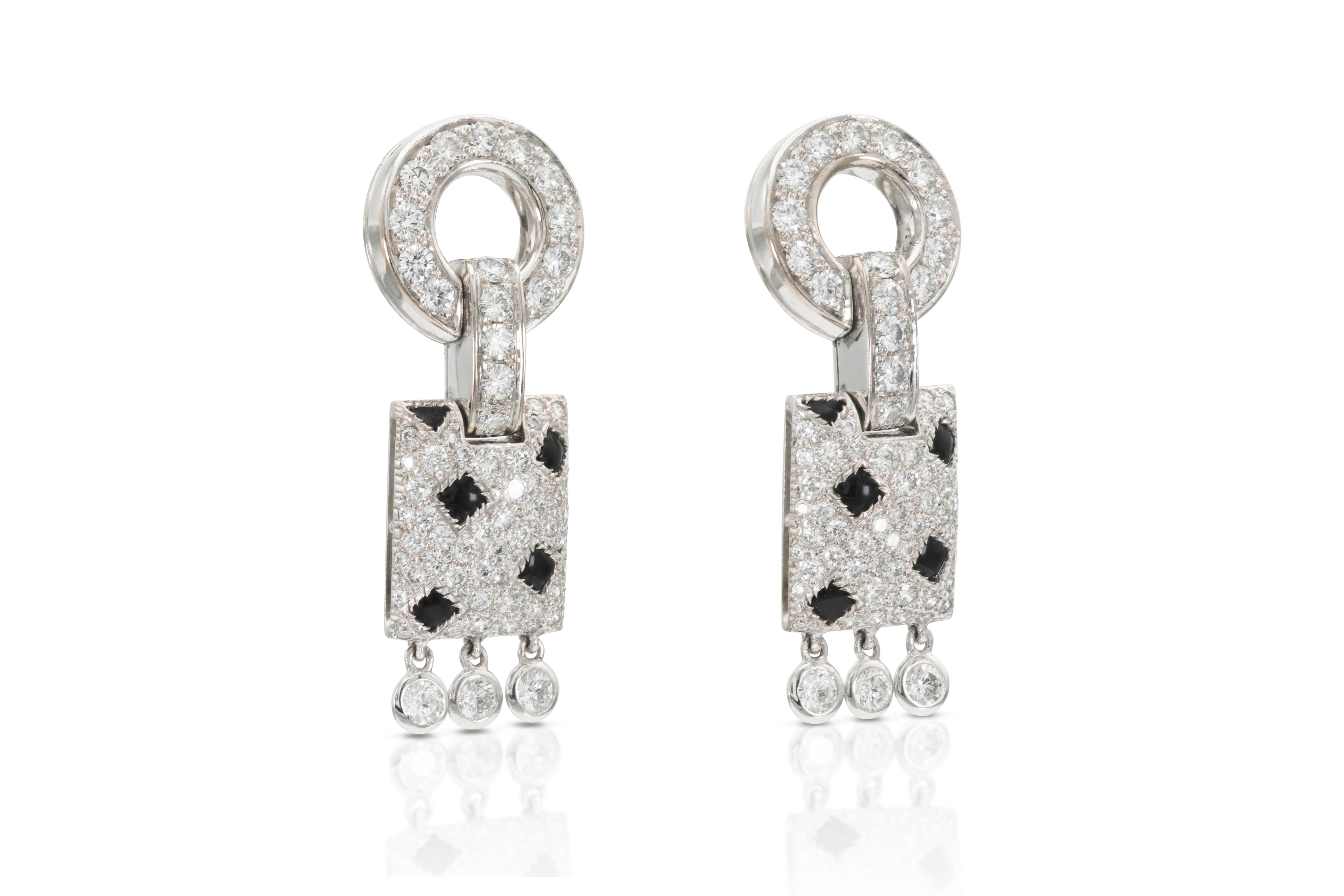 Finely crafted in 18k white gold with Round Brilliant cut Diamonds weighing approximately a total of 2.00 carats and Onyx.
Signed by Cartier
1 1/4 inch length
Comes with its Certificate of Authenticity and original box.