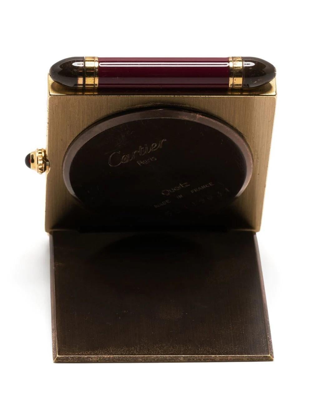 Cartier showcases its traditional horology expertise with this pre-owned alarm clock. Channelling a classic design aesthetic, the hand-wound pendulette is designed to sit tableside and boasts a signature square face with Roman numerals around the