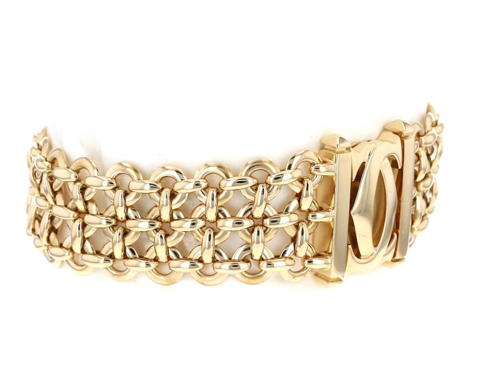 Cartier Bracelet in 18K Gold Penelope collection Double C bracelet.
The flexible bracelet comprising three rows of interlocking rings, to the iconic double 