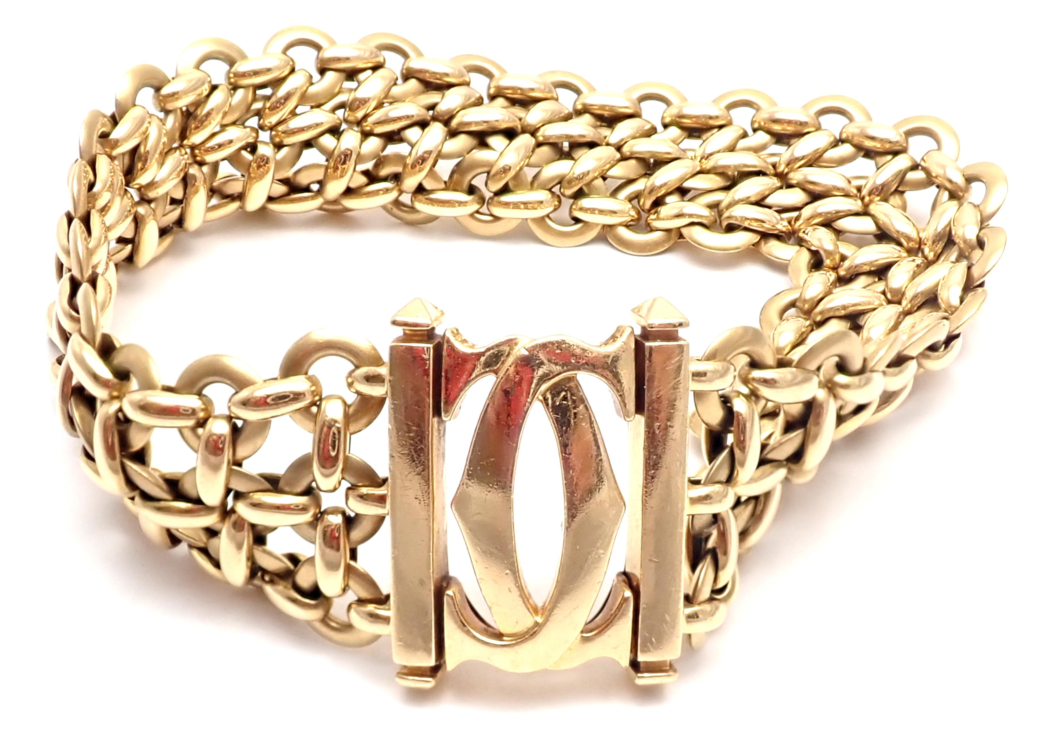 18k Yellow Gold Double C Three Row Wide Link Penelope Bracelet by Cartier. 
This bracelet comes with original Cartier box.
Details: 
Weight: 57.9 grams 
Length: 7