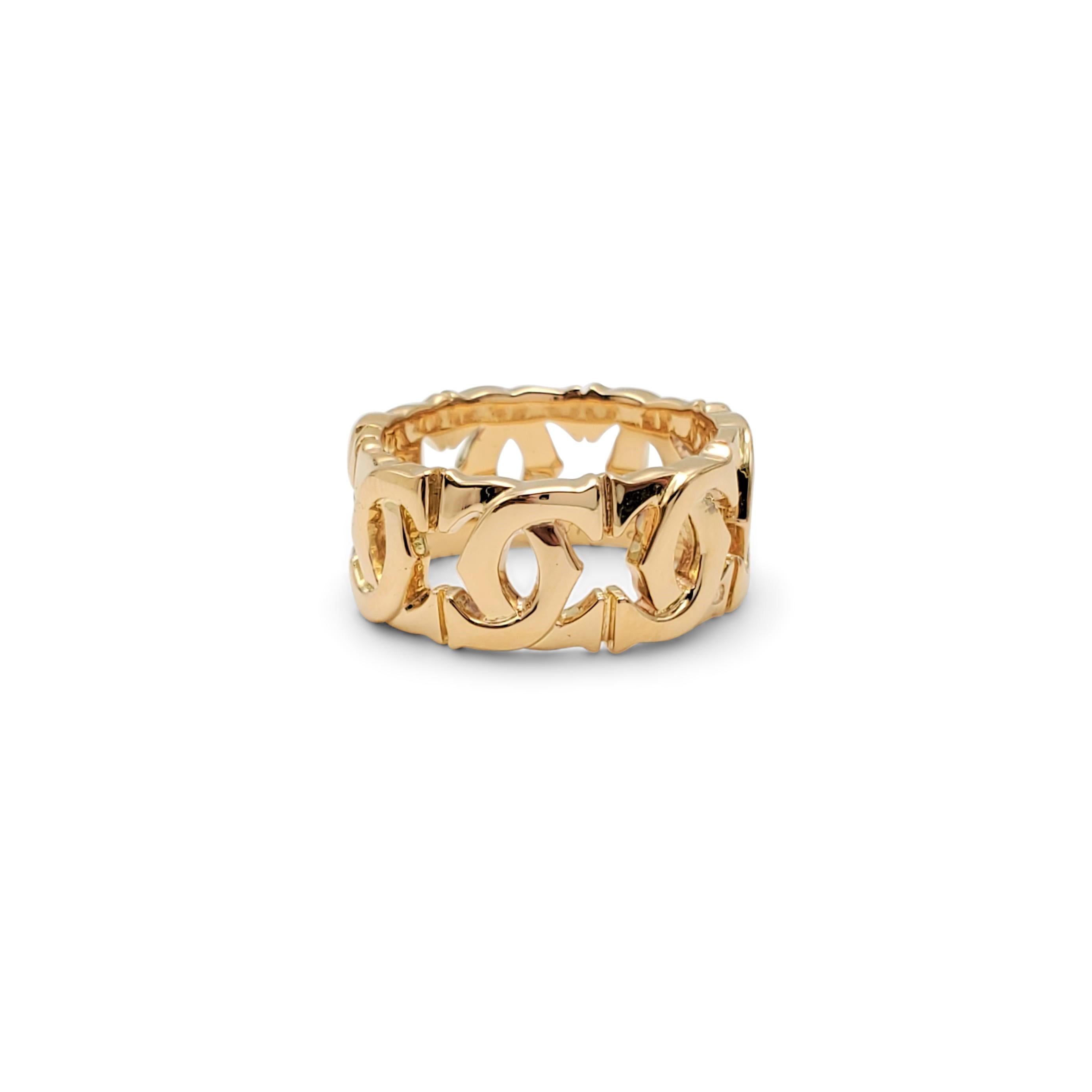 Authentic Cartier 'Penelope' ring crafted in 18 karat yellow gold is comprised of interlocking Cartier double-C motifs. Signed Cartier, 750, with serial number. Ring size 5. The ring is not presented with the original box or papers. CIRCA