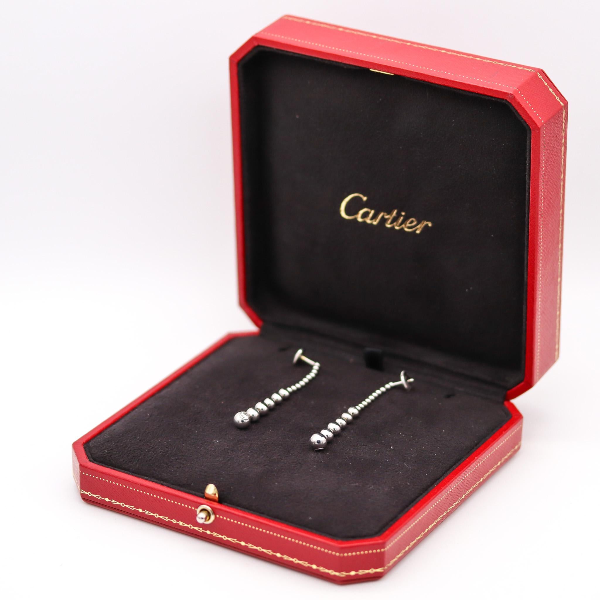 Perles de diamants dangle drop earrings designed by Cartier.

Beautiful contemporary dangle drop earrings, created in Paris France by the jewelry house of Cartier, back in the 1999. They are from the Perles De Diamants collection and were crafted