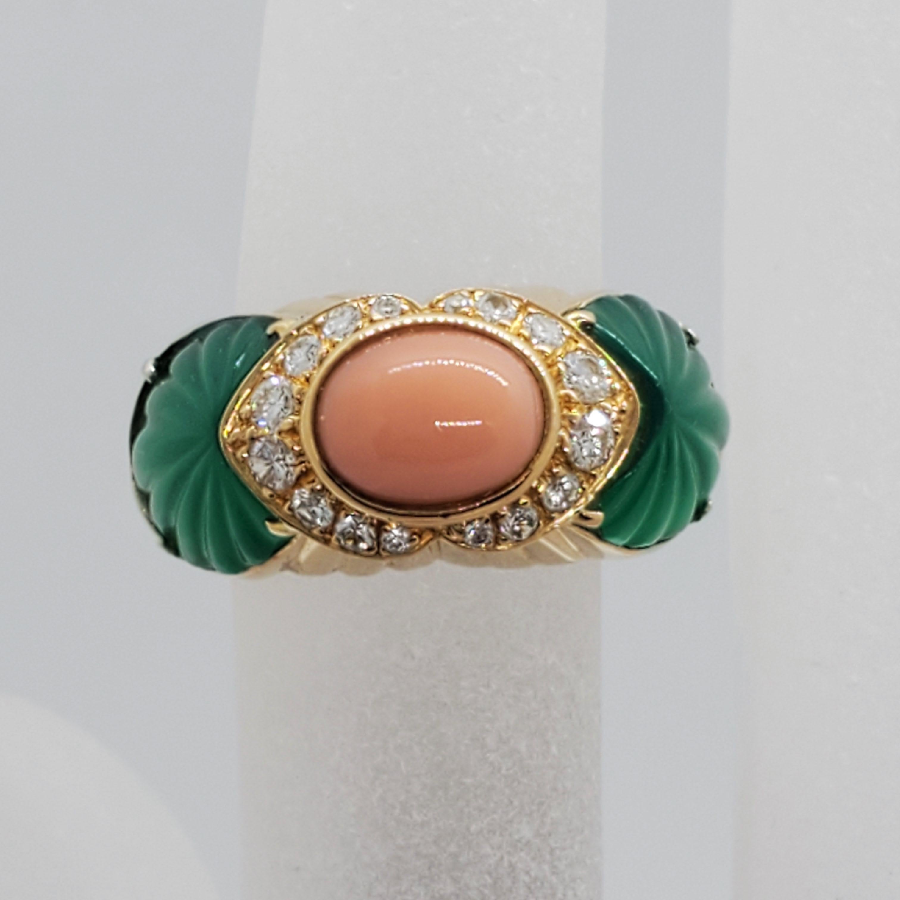 Gorgeous Cartier estate pink coral oval cabochon and carved chalcedony ring in 18k yellow gold. Diamond weight is 0.20 cts. Very unique design and easy to wear day or evening. Size 3.75.