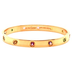 Bracelet en or rose et serti de pierres précieuses, 'Love', de Cartier