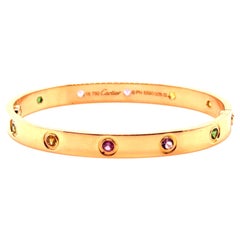Bracelet en or rose et serti de pierres précieuses, 'Love', de Cartier