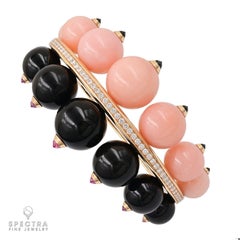 Cartier Bangle con opale rosa e diamante onice in oro giallo 18 carati - Gioielli firmati