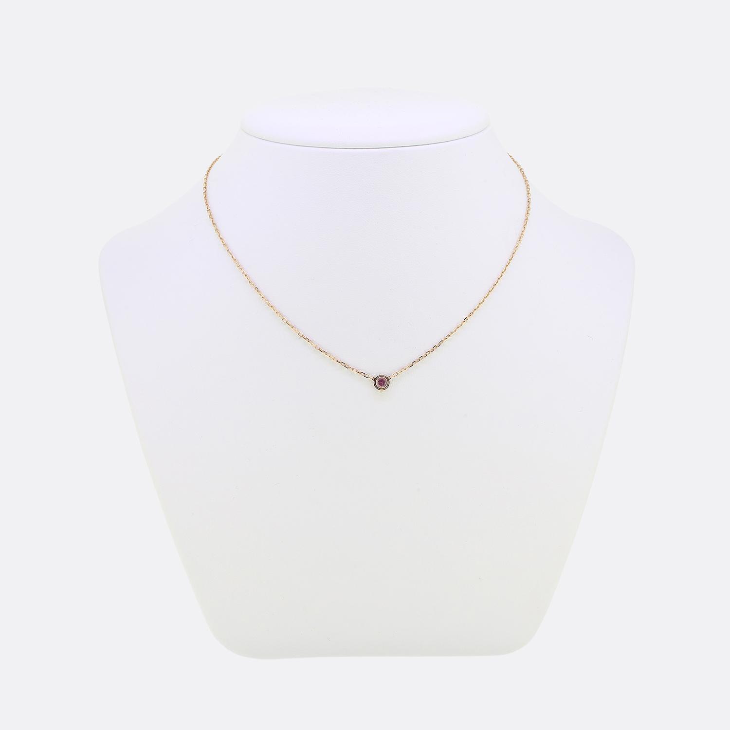 Here we have a fabulous 18ct rose gold necklace from the world renowned jewellery house of Cartier. This piece forms part of their iconic 'd'Amour' collection and features a single round faceted pink sapphire amidst a circular stepped setting. This