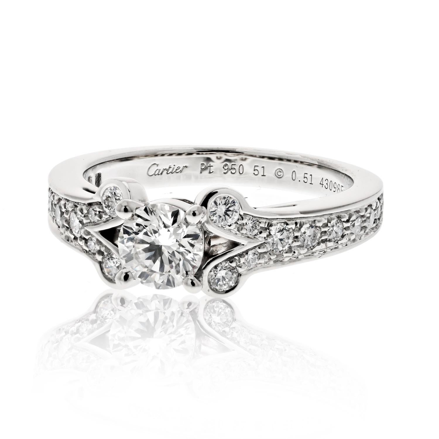 The Cartier diamond engagement ring from the Ballerine collection is a stunning piece of jewelry crafted from platinum and mounted with a 0.51ct round diamond (F-G color, VS1-VS2 clarity approx.) in the center. Additional diamonds also accent this