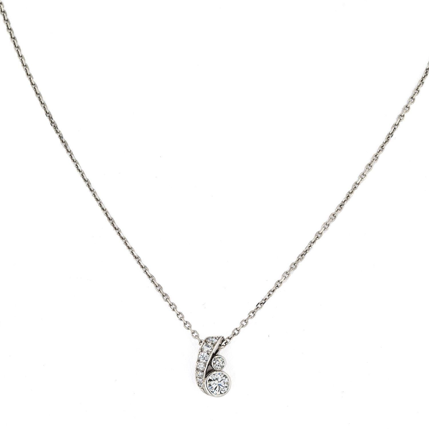 Platinum Cartier solitaire diamond pendant featuring 10 round cut diamonds of 0.80cttw. 
Two center diamonds are bezel set one on top of the other 8 are framing the two on one side. 
16 inches long. 