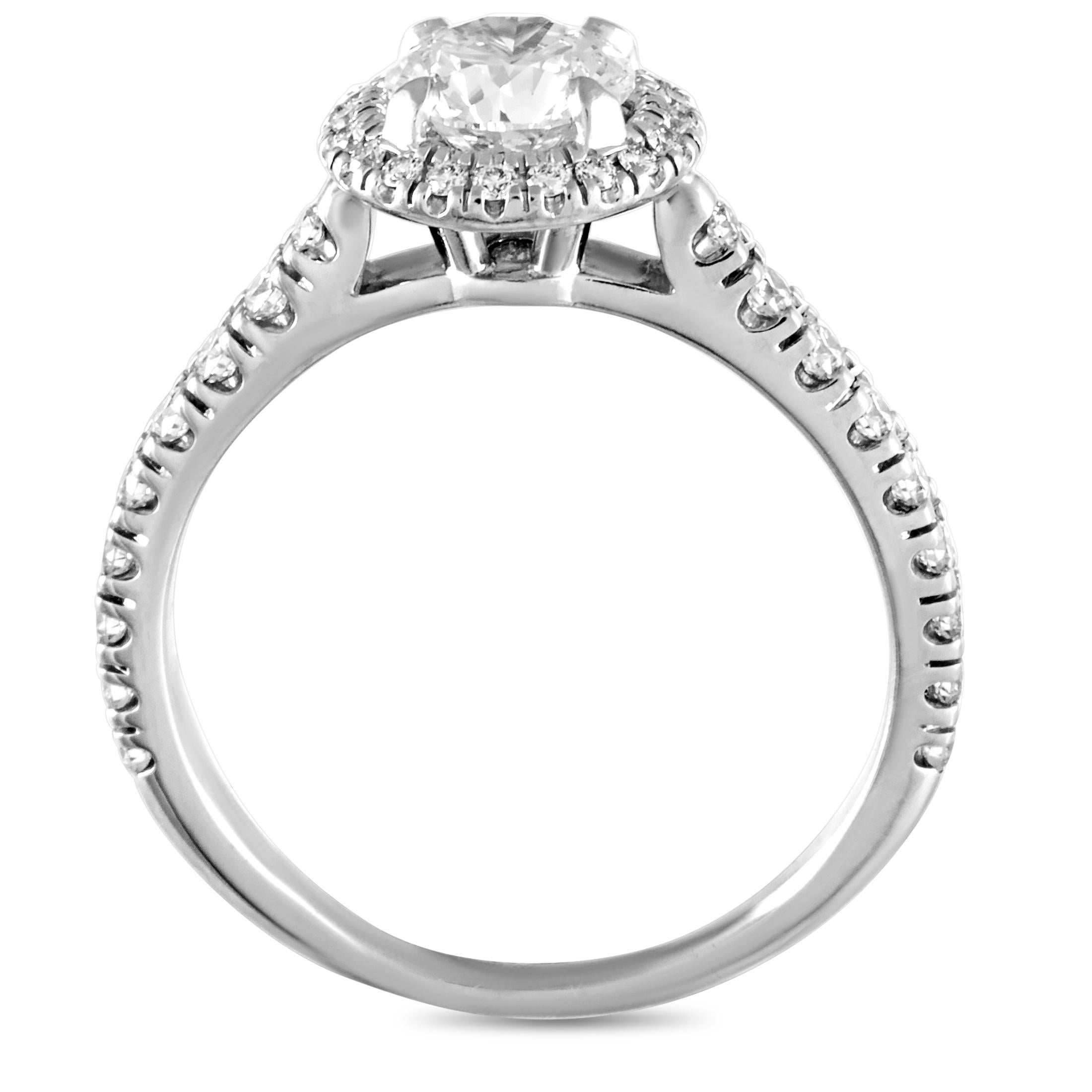 This Cartier engagement ring is crafted from platinum and weighs 4.3 grams. It boasts band thickness of 2 mm and top height of 6 mm, while top dimensions measure 20 by 9 mm. The ring is set with a total of 1.18 carats of diamonds, with the center