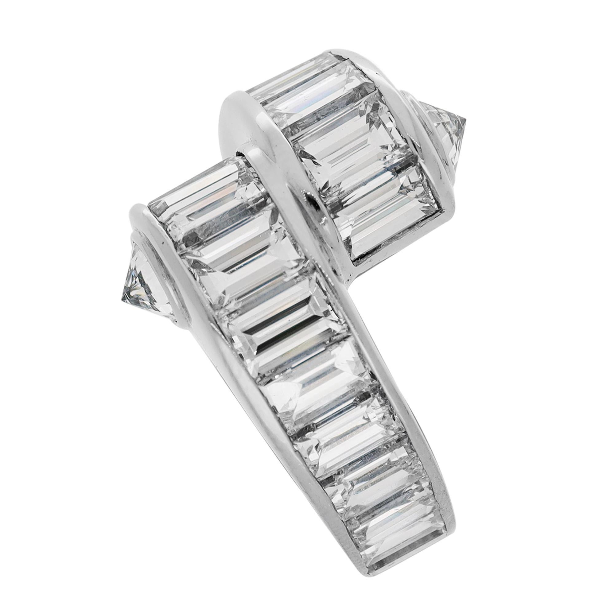 Cartier Platinum and Baugette Diamond Menotte Ring.
The 'Menotte' collection from Cartier showcases a unique design feature that sets it apart – a handcuff that symbolizes the bonds of love and commitment. This subtle yet intricate detailing adds an