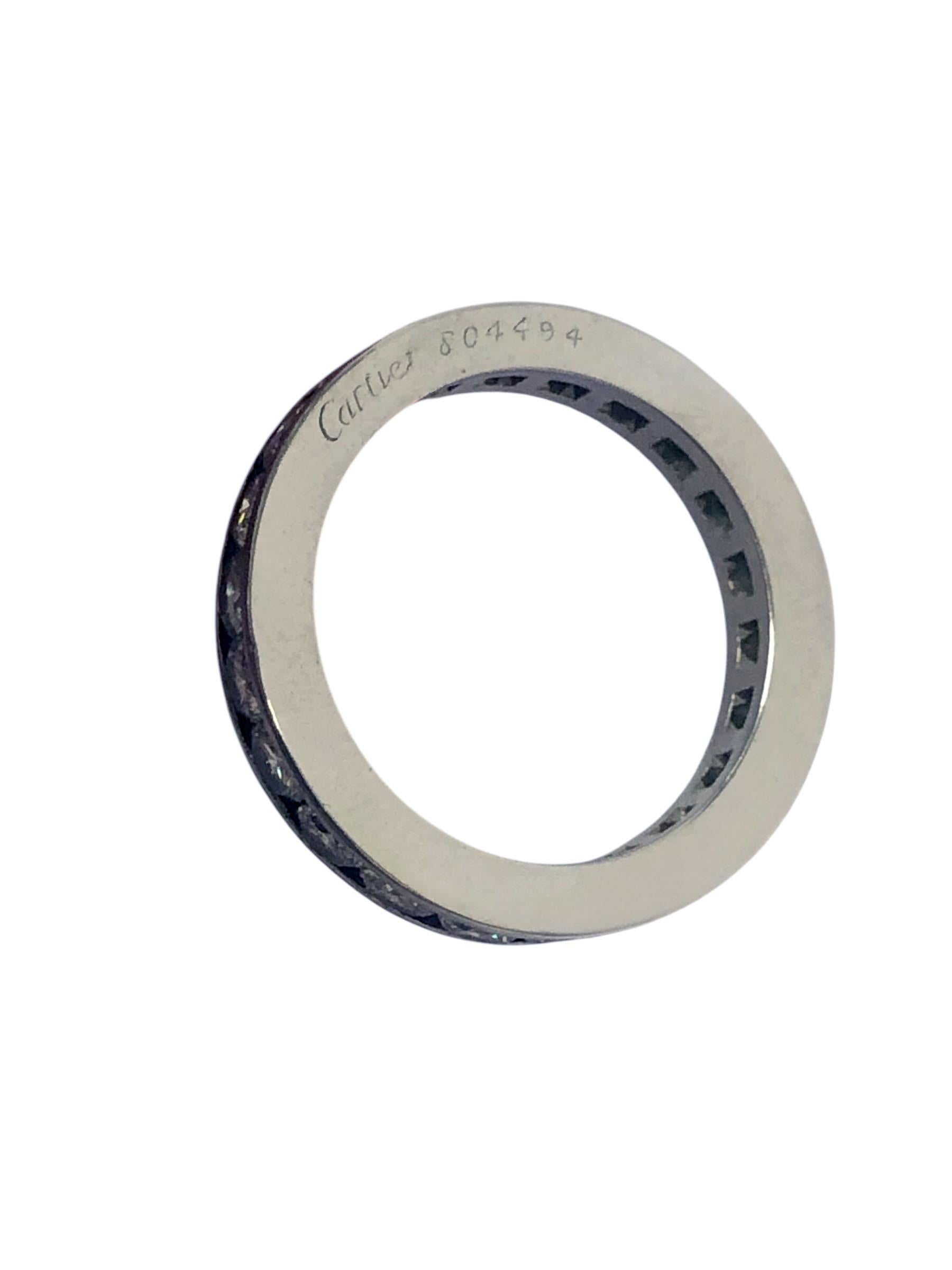 Circa 1990s Cartier Platinum and Diamond Eternity Band Ring, the 3.5 m.m wide Ring is Chanel set with 22 Round Brilliant cut Diamonds totaling 2.64 Carats and Grading as G in Color and VS in Clarity. Finger size 6.5. Signed, numbered and comes in a