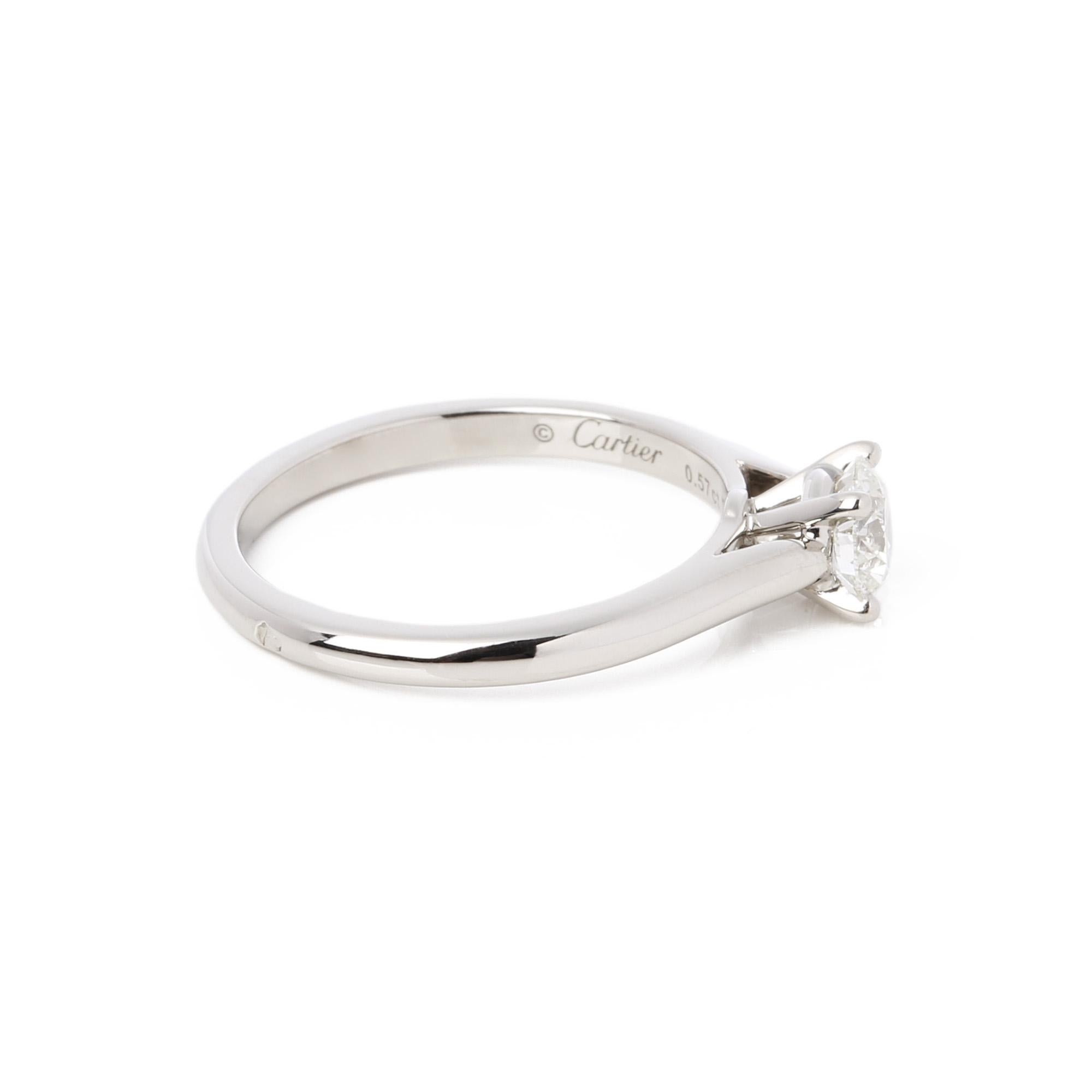 This ring by Cartier features a single round brilliant cut diamond, totalling 0.57ct, colour H, clarity VVS1 set in Platinum. 