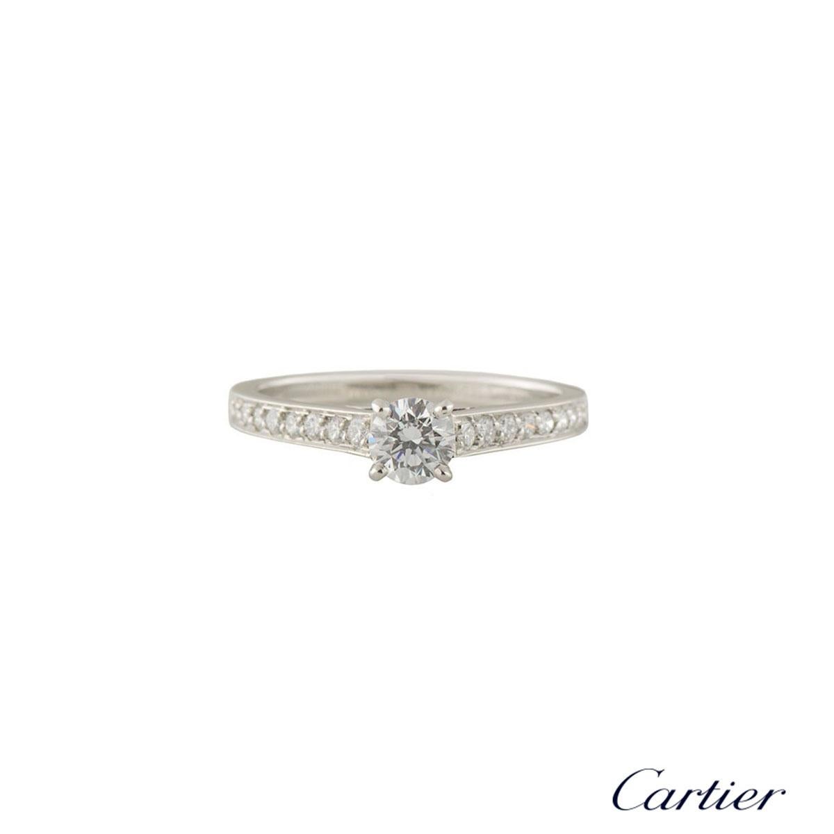 A beautiful Cartier diamond ring in platinum from the 1895 collection N4164647. The ring comprises of a round brilliant cut diamond in a claw setting with a total weight of approximately 0.35ct, G colour and VVS clarity. The ring features 10 round