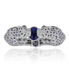 CARTIER Platinum, Diamond and Sapphire Two Panther Head Bangle