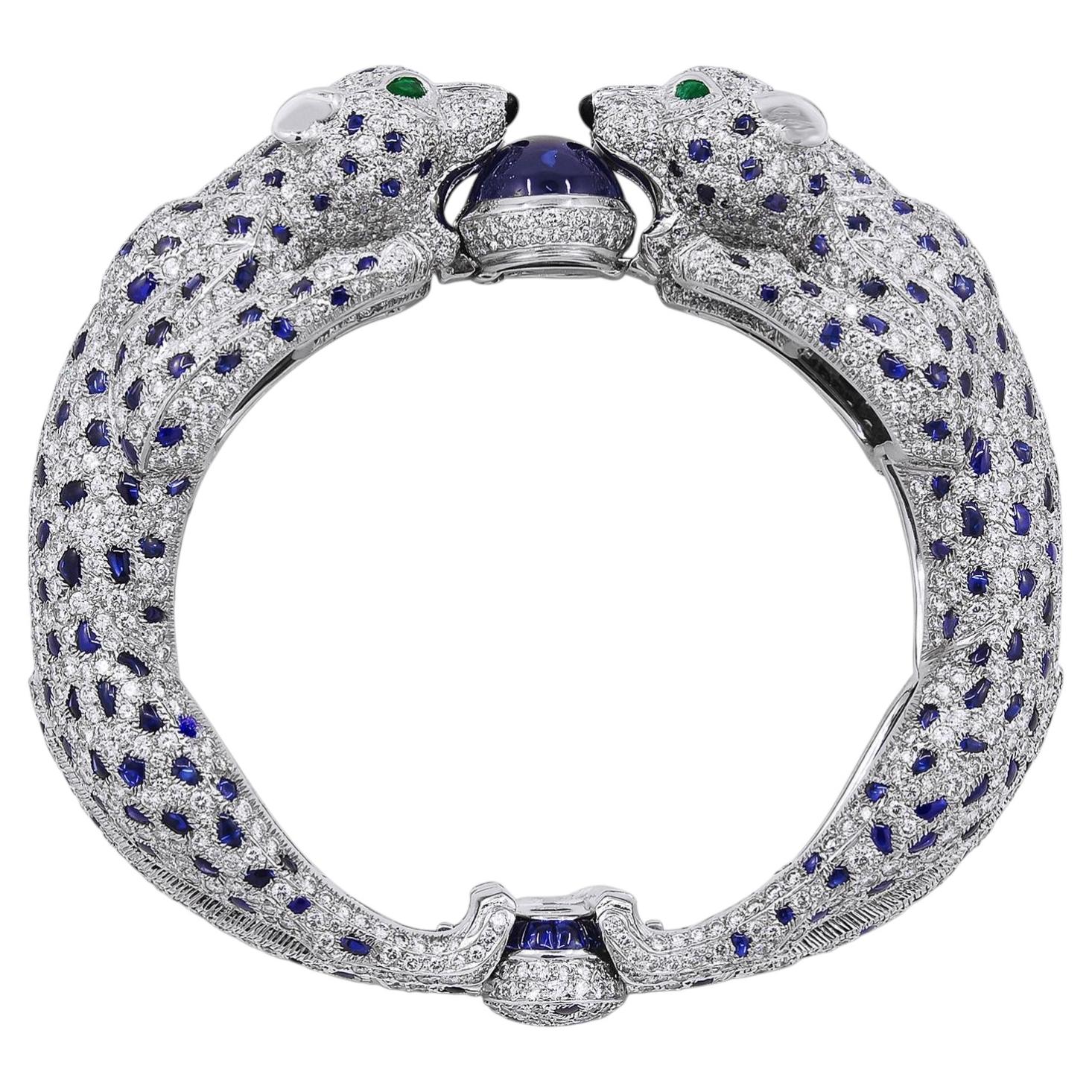 CARTIER Platinum, Diamond and Sapphire Two Panther Head Bangle For Sale