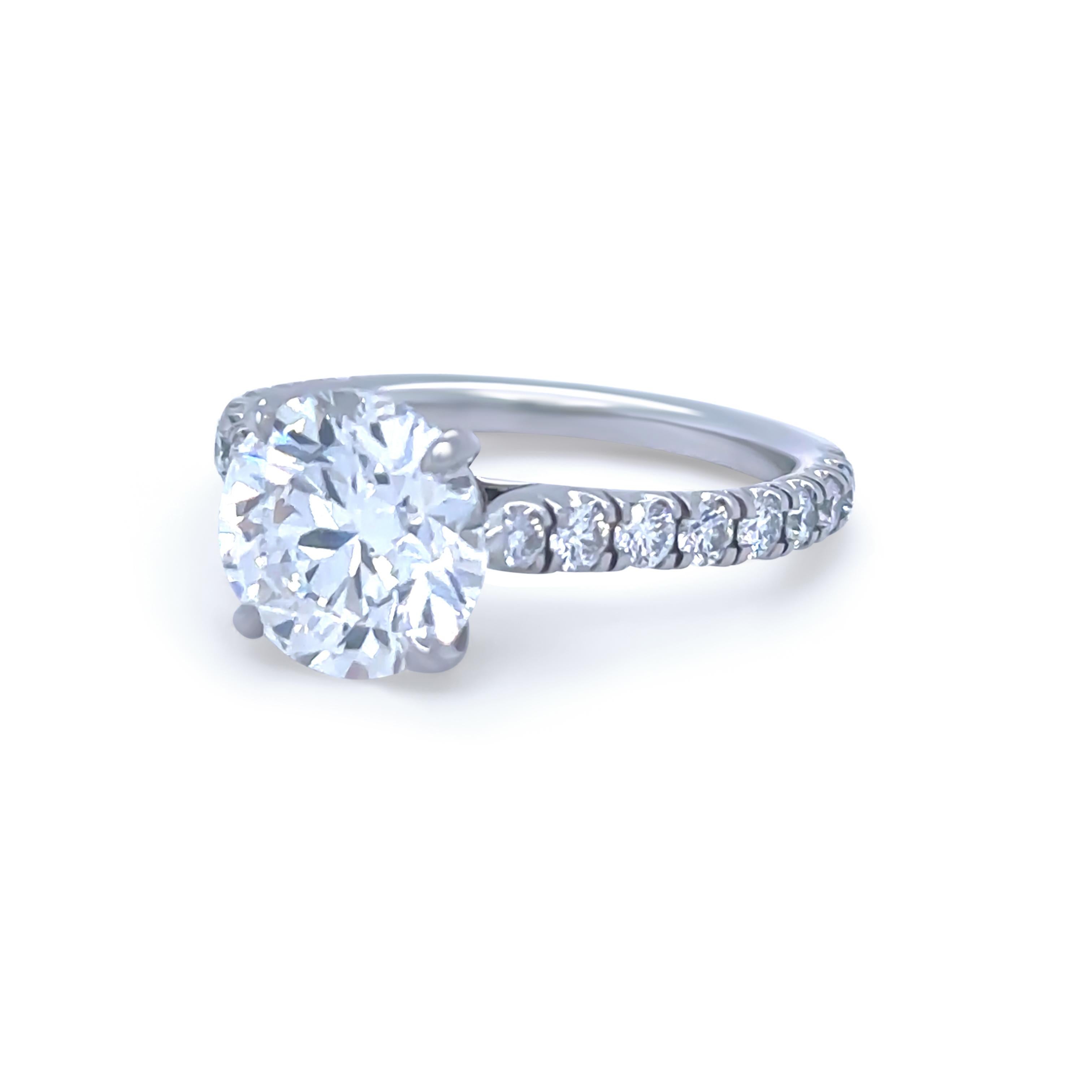 This extraordinary Cartier diamond engagement ring is masterfully crafted in luxurious 950 platinum, offering both prestige and timeless elegance. At its centre is a stunning 2.73ct round brilliant-cut diamond, graded F colour and VS2 clarity,