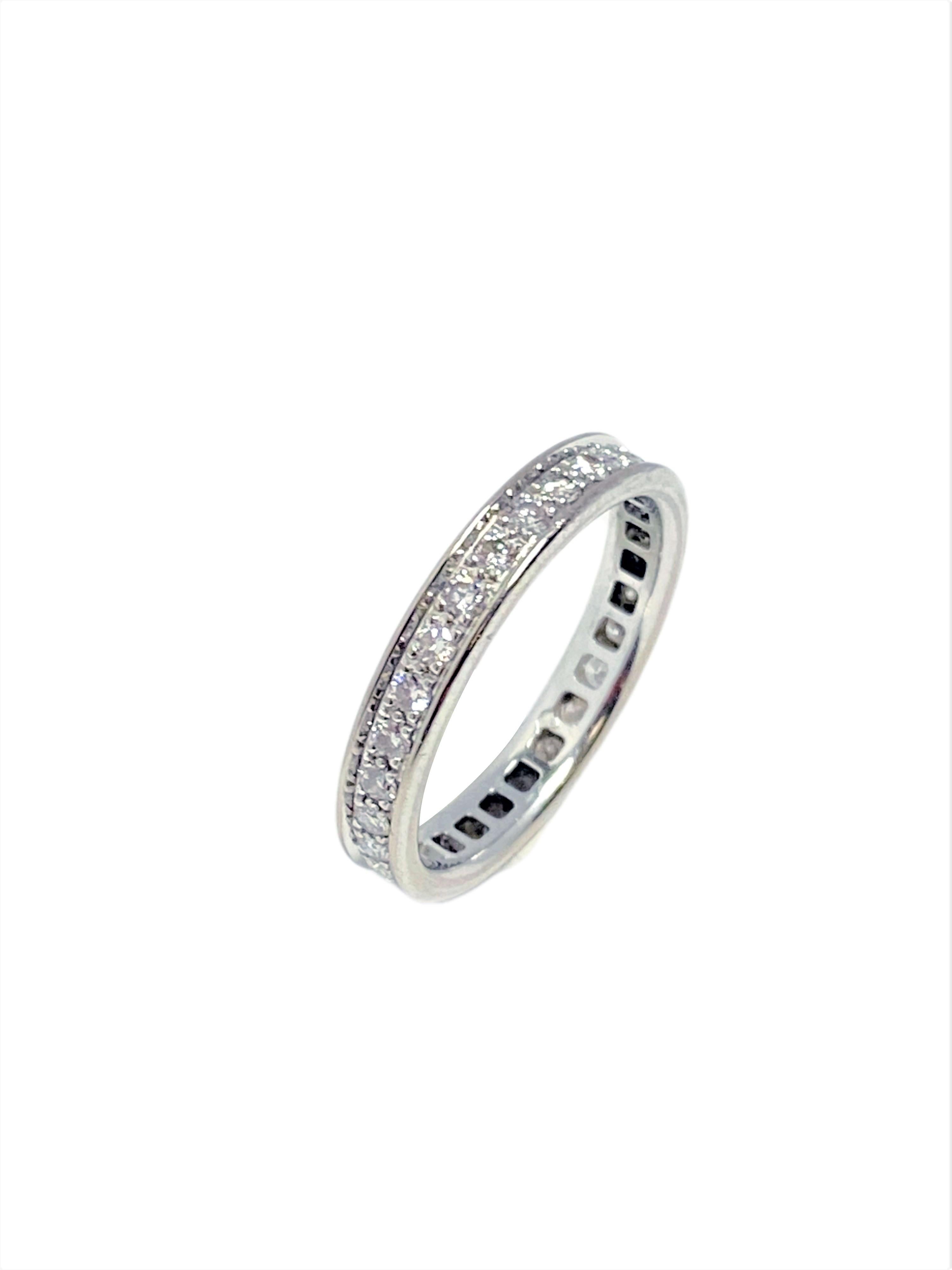 Circa 2007 Cartier Platinum Eternity Band Ring, 3 M.M. wide and a finger size 5 1/2, each Diamond in the channel is prong set, Fine white Round Brilliant cut Diamonds totaling 1 carat. signed, numbered and comes in the Original Cartier Presentation