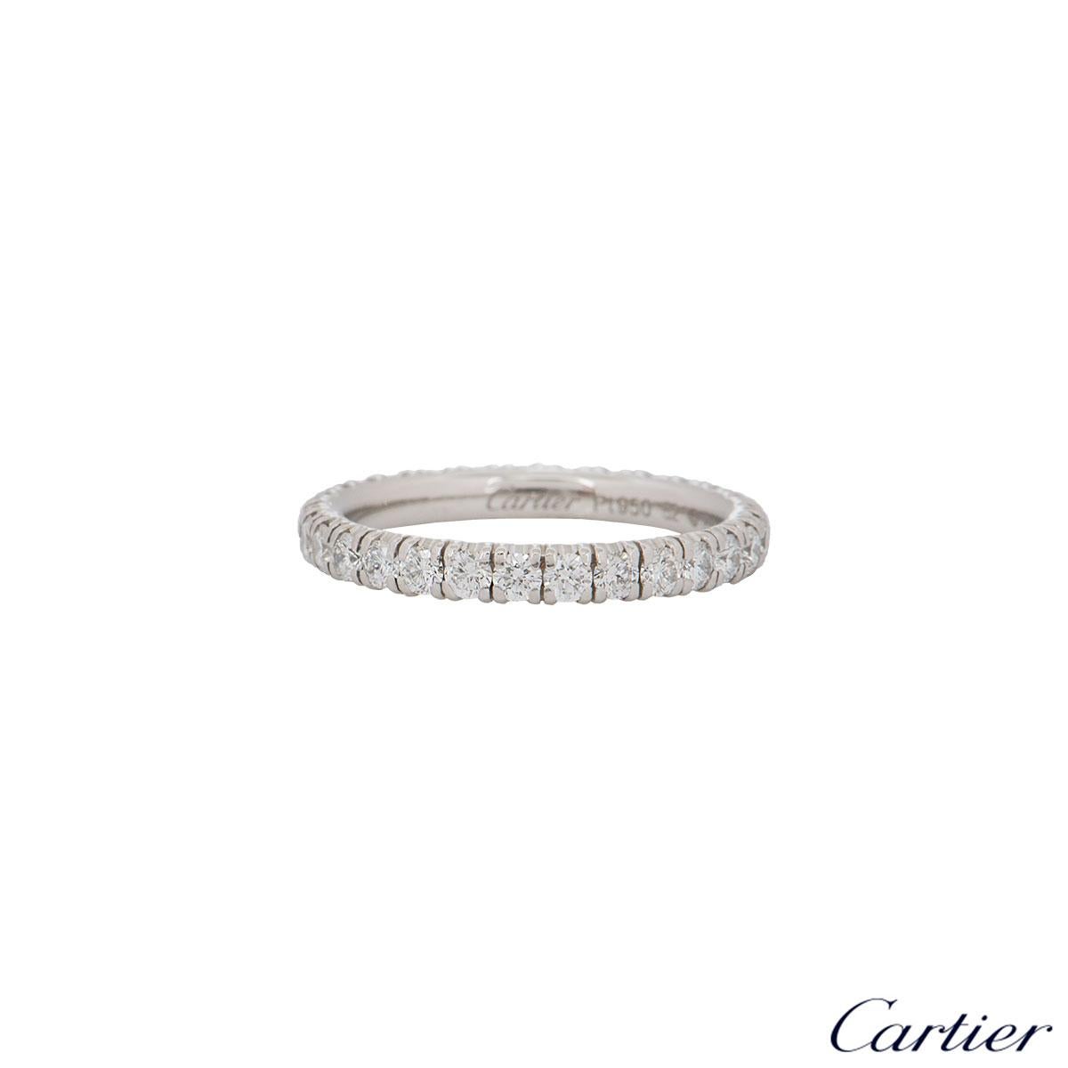 An alluring 18k white gold Cartier diamond eternity ring from the Étincelle De Cartier collection. The ring comprises of 29 round brilliant cut diamonds with a weight of 0.93ct in a shared 4 claw setting all the way round. The ring is a size UK M,