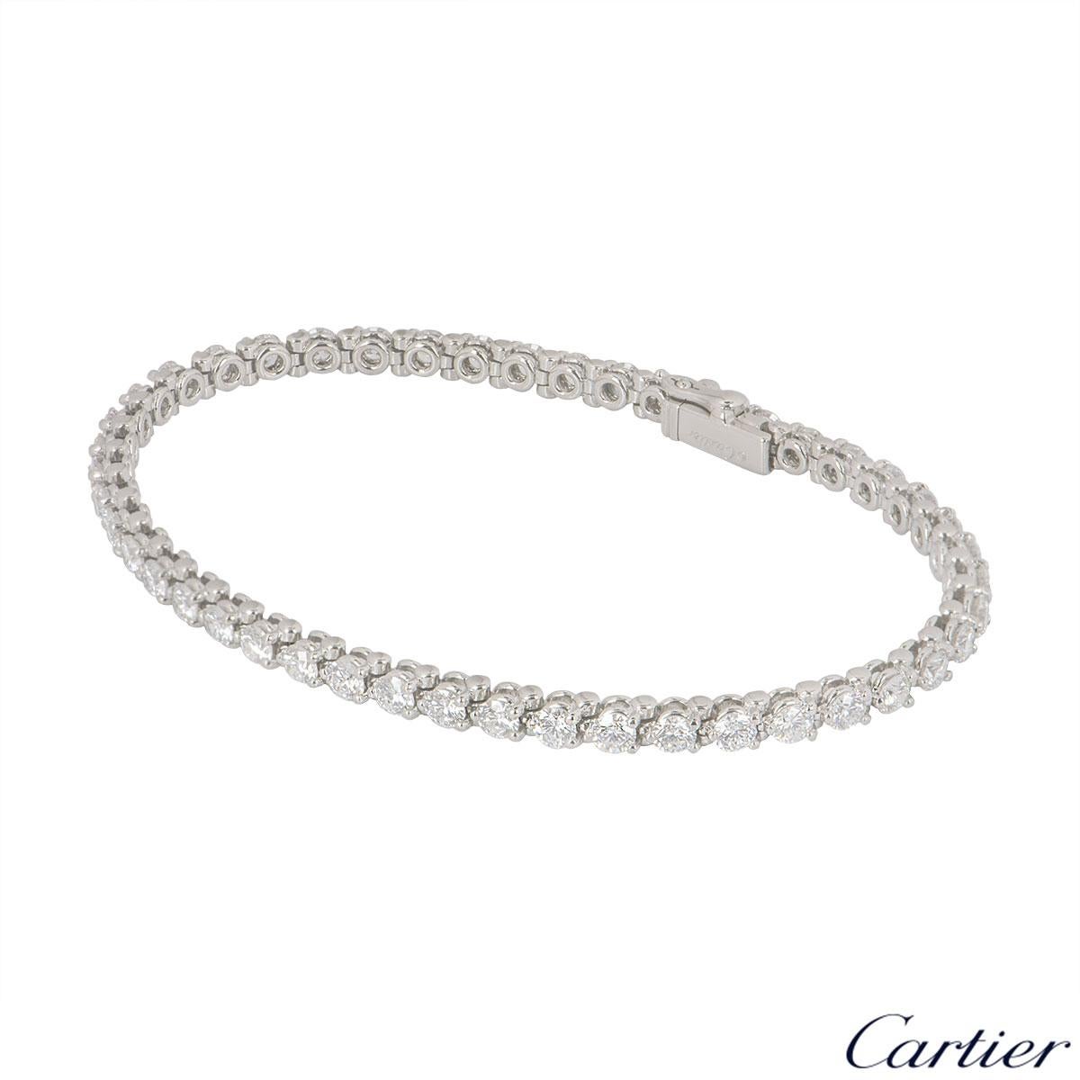 A platinum diamond line bracelet by Cartier. The bracelet features 46 round brilliant cut diamonds each individually set in a 3 claw setting with an approximate total weight of 4.60ct. The bracelet features a box clasp with a length of 6.90 inches