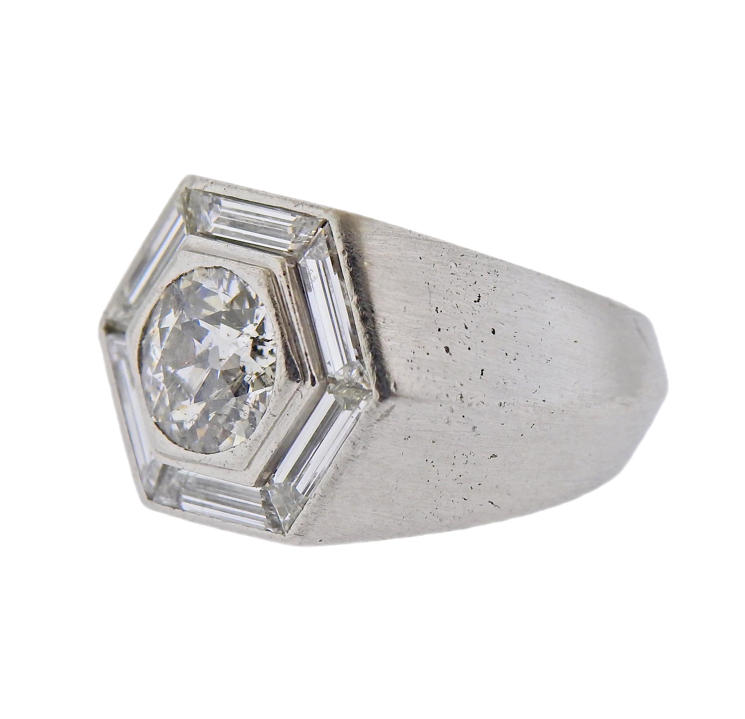 Platinum Cartier ring, with center approx. 1.72ct diamond, surrounded with baguette diamonds. Ring size - 6, ring top is 15mm wide. Marked: Cartier. Weight - 23.4 grams.