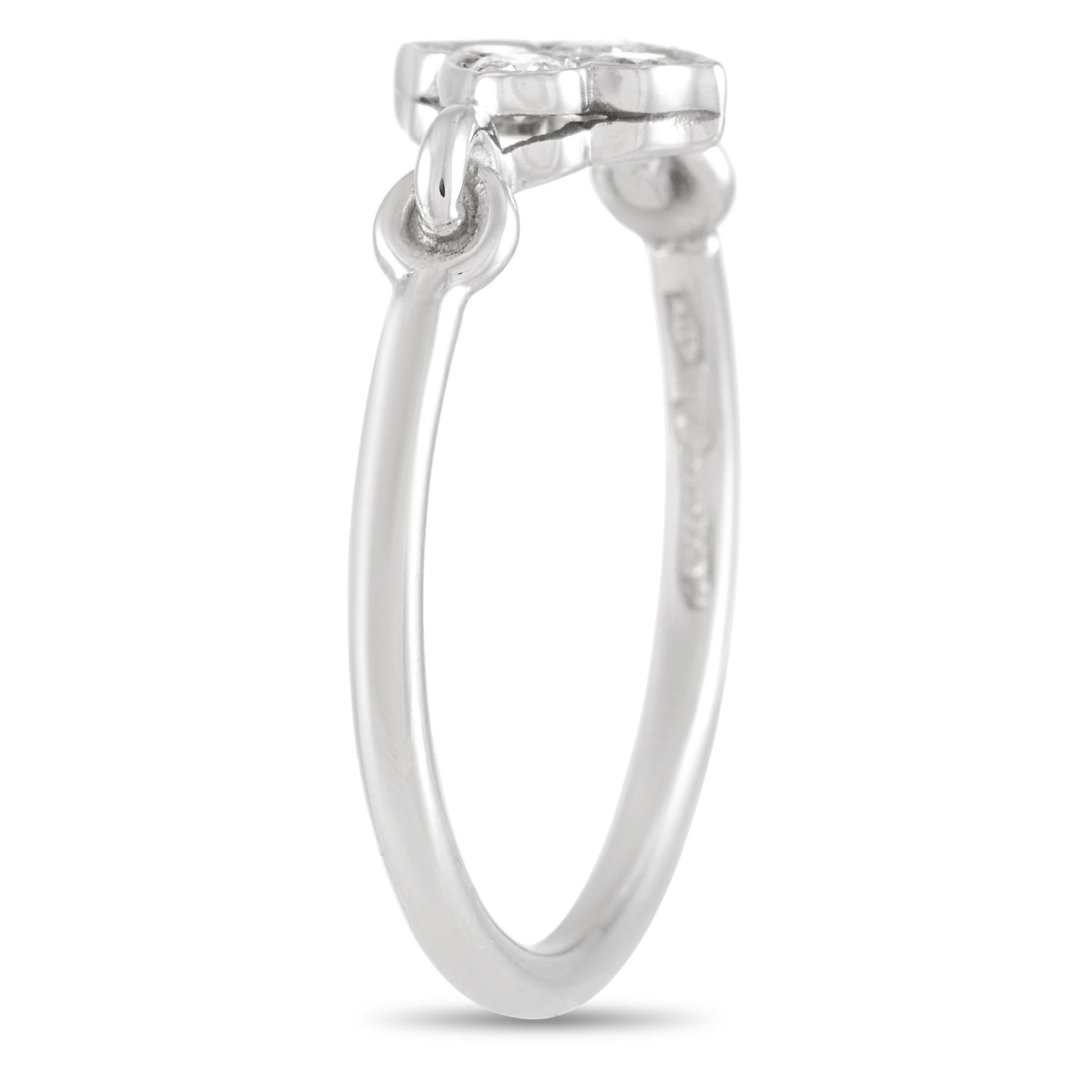 This Cartier Platinum Diamond Ring is a fun twist on a classic diamond ring. The ring is made with Platinum and is set with four round-cut diamonds in a pretty motif. The diamond motif is connected to the rest of the band with interlocking platinum