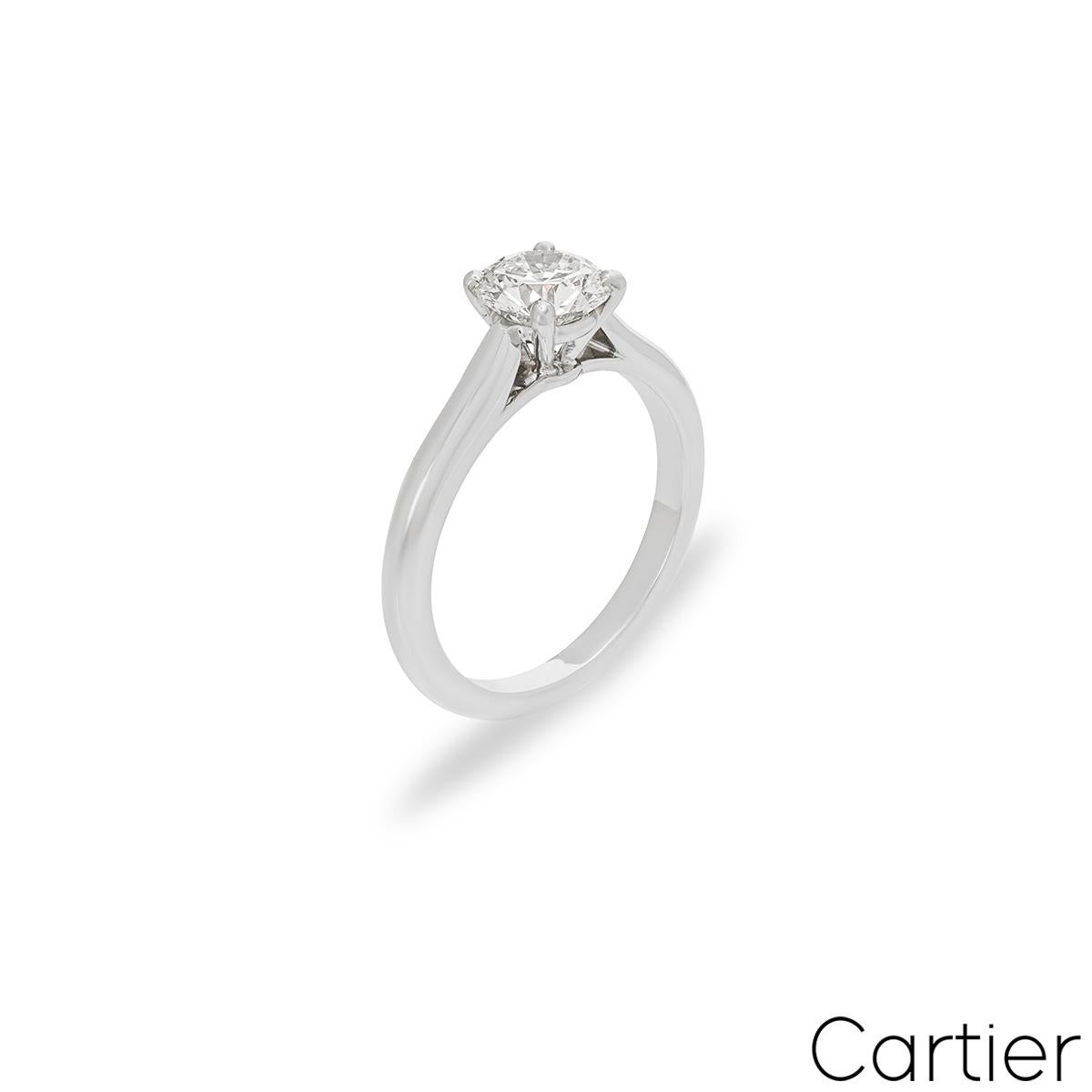 A captivating platinum diamond engagement ring by Cartier from the Solitaire 1895 collection. The ring comprises of a round brilliant cut diamond in a four prong setting weighing 1.21ct, F colour and VVS1 clarity. The diamond scores an excellent