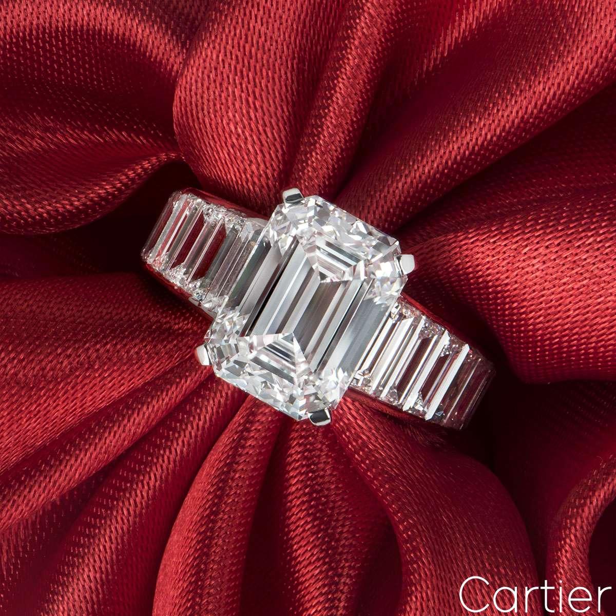 RRP for this ring is £500,000.  A stunning emerald cut diamond ring by Cartier in platinum. The ring is set to the centre with a 4.12ct diamond, E colour and VVS2 clarity. Complimenting the central diamond are 18 baguette cut diamond set shoulders