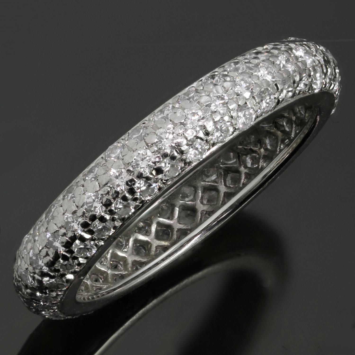 This classic Cartier dome-shaped wedding is made in fine platinum and pave-set with brilliant-cut round E-F-G VVS1-VVS2 diamonds weighing an estimated 1.30 carats. A timeless design and a comfortable fit for every day elegance. Made in France circa