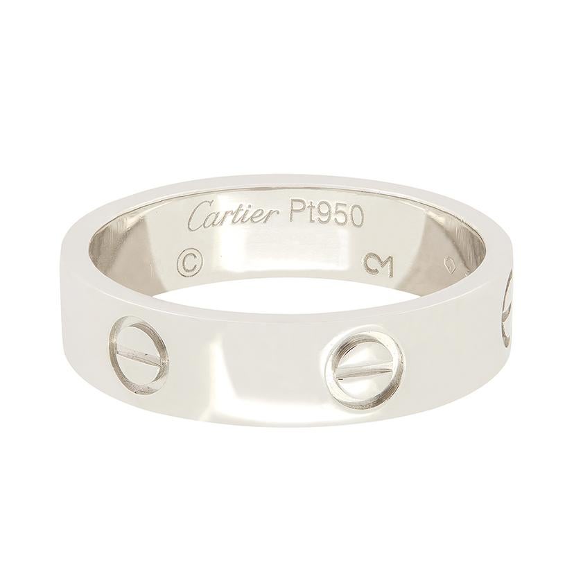 From Cartier’s iconic LOVE collection comes this wonderful love ring.  Crafted in platinum the band features the classic screw pattern all the way around. It has all the original makers marks on the inside of the band and comes with its original