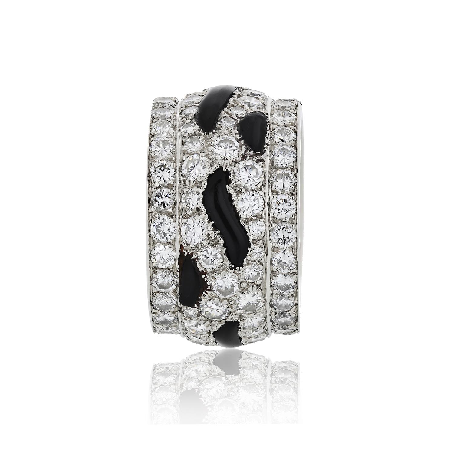 A vintage Cartier diamond band ring in platinum, set with round-cut diamonds and onyx from Cartier's Nigeria collection.
Ring Width: 12.5mm
Ring Size: 5 
Carat Weight: 4.50cts.