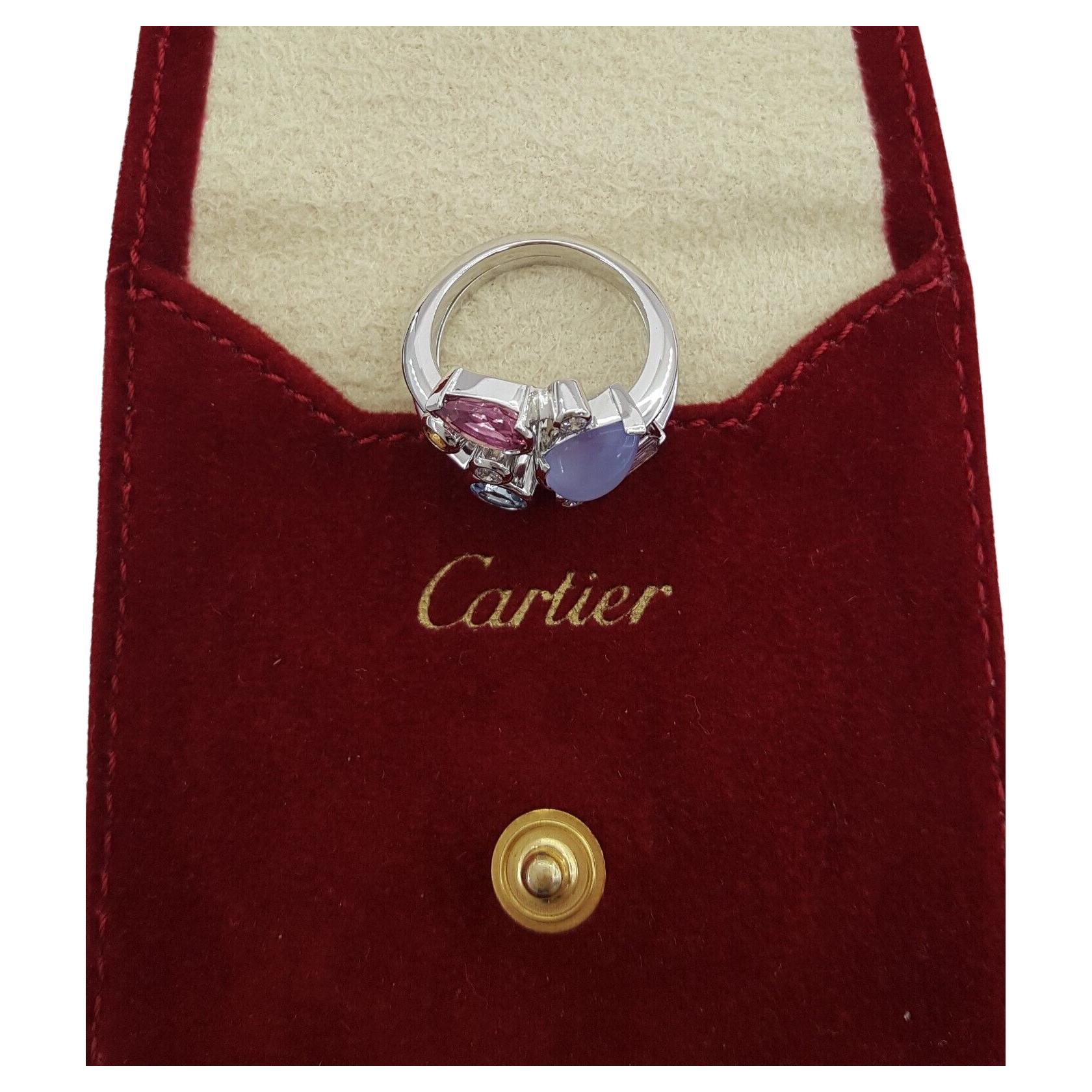 Cartier Platinum Ring adorned with Diamonds and Multicolor Gemstones, sized 52 in the French system or US 6. This exquisite piece, weighing 11.2 grams of solid Platinum, boasts a width of 17.6mm. The design features 3 Natural Round Brilliant Cut
