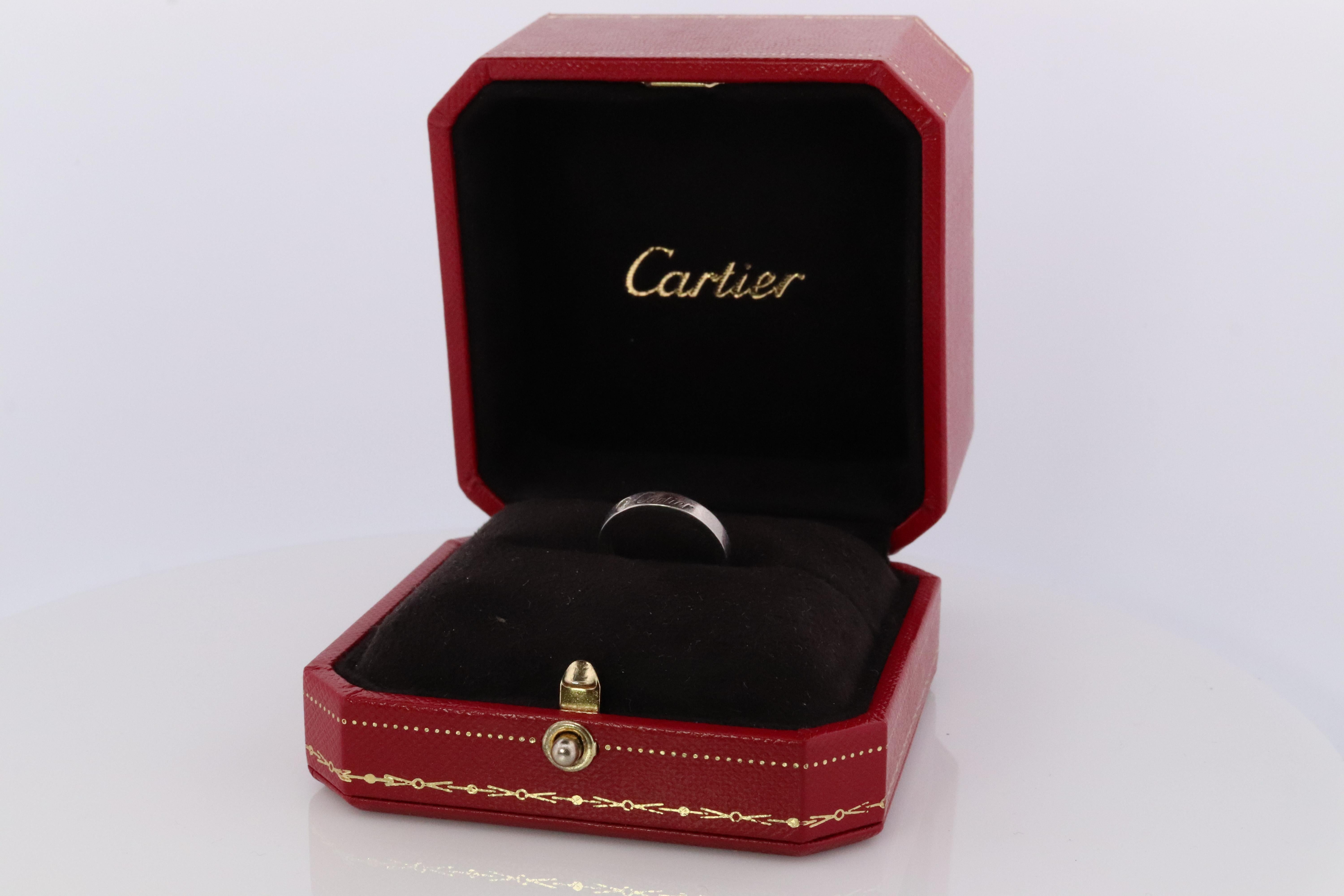 Cartier Platinum 3mm Band.

Genuine Cartier Diamond Signature ring.

Condition: Great. Comes with Original Cartier box.

Details:
4.5grams total

Size 4