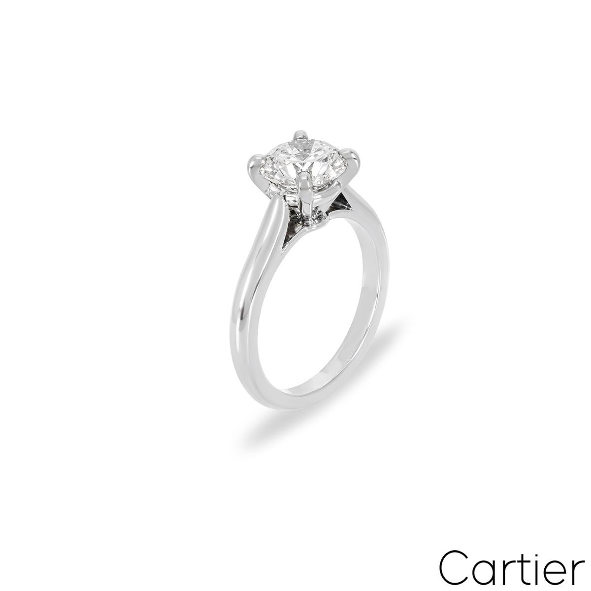 A captivating platinum diamond engagement ring by Cartier from the Solitaire 1895 collection. The ring comprises of a round brilliant cut diamond in a four prong setting weighing 1.37ct, G colour and VVS1 clarity. The diamond scores an excellent