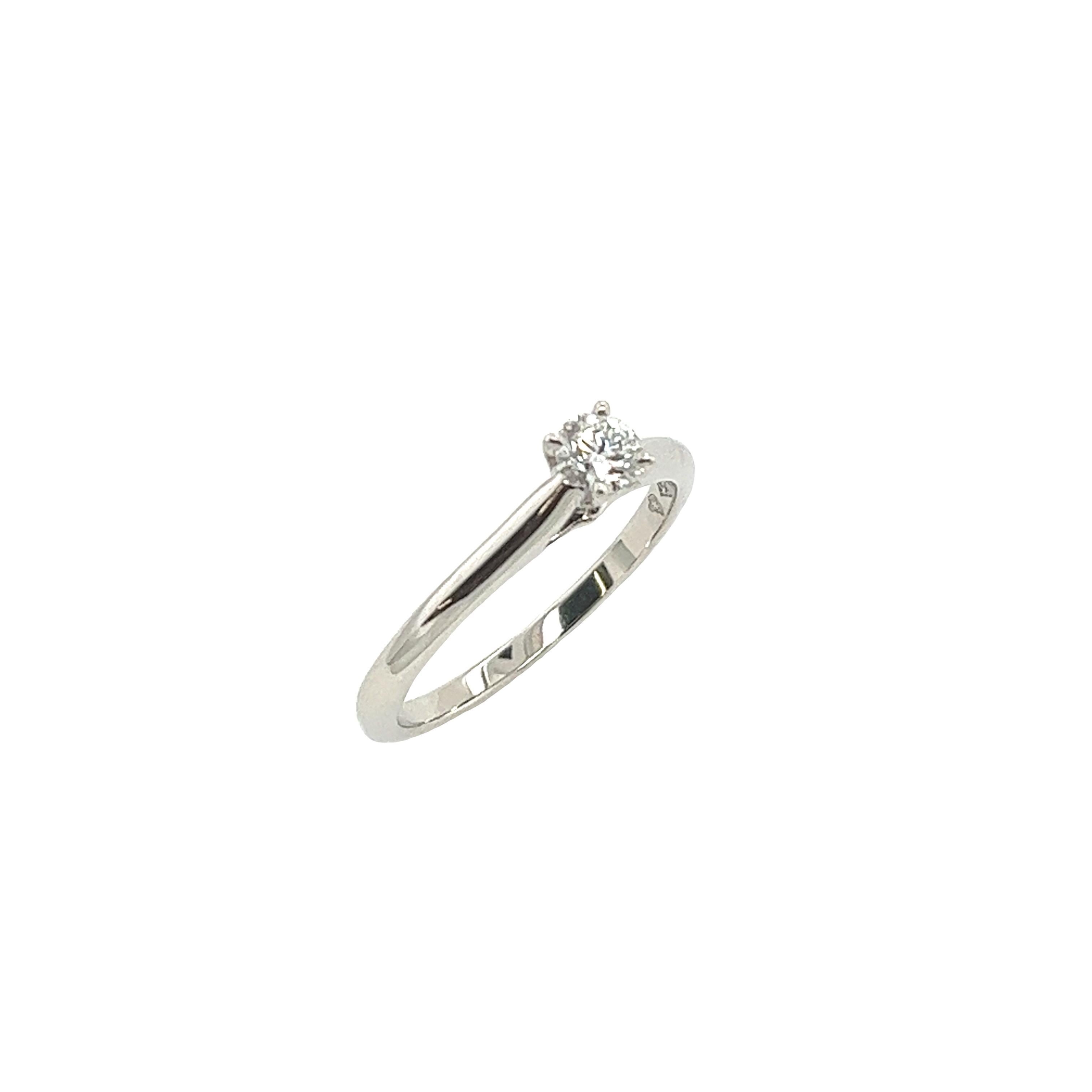 Experience the epitome of luxury with the Cartier Platinum Solitaire Diamond Ring. Featuring a GIA-certified 0.25-carat F/VVS2 round diamond, this exquisite piece embodies sophistication and timeless elegance. Set in platinum, its classic design