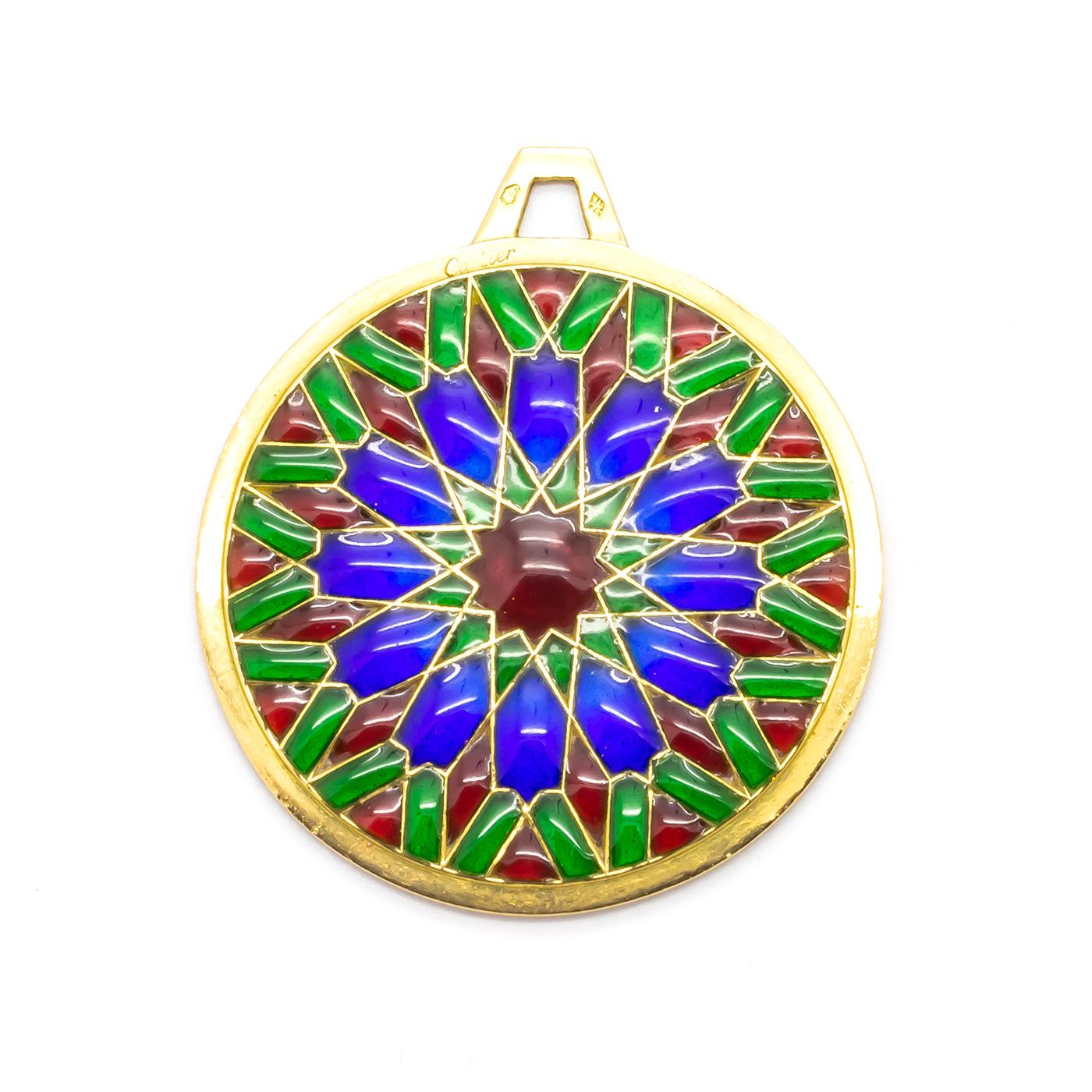 A vintage, Cartier, plique à jour translucent enamel pendant, inspired by cathedral rose windows, with red, blue and green colours in a floral design, with a French eagle head mark for 18ct gold and a maker's mark, signed Cartier and numbered 09349,