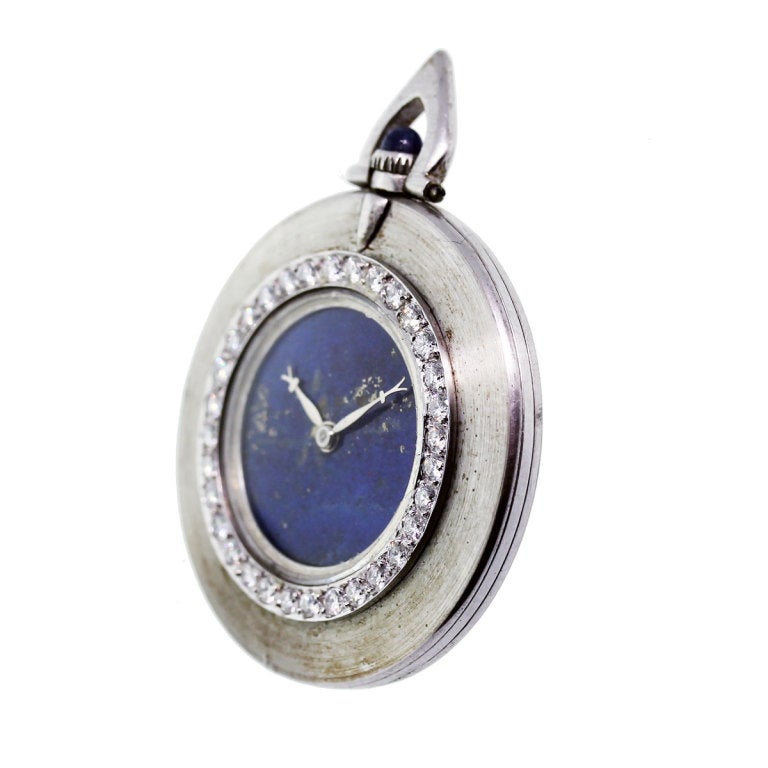 Company: Cartier
Case Material: 18K White Gold
Measurements: Entire Watch Measures 40 mm x 41mm
Dial: Lapis Lazuli Dial
Movement: Mechanical (Manual Wind)
Crystal: Plastic Crystal
Bezel: Diamond Bezel. Approximately 3.3ctw of Diamonds that are G/H