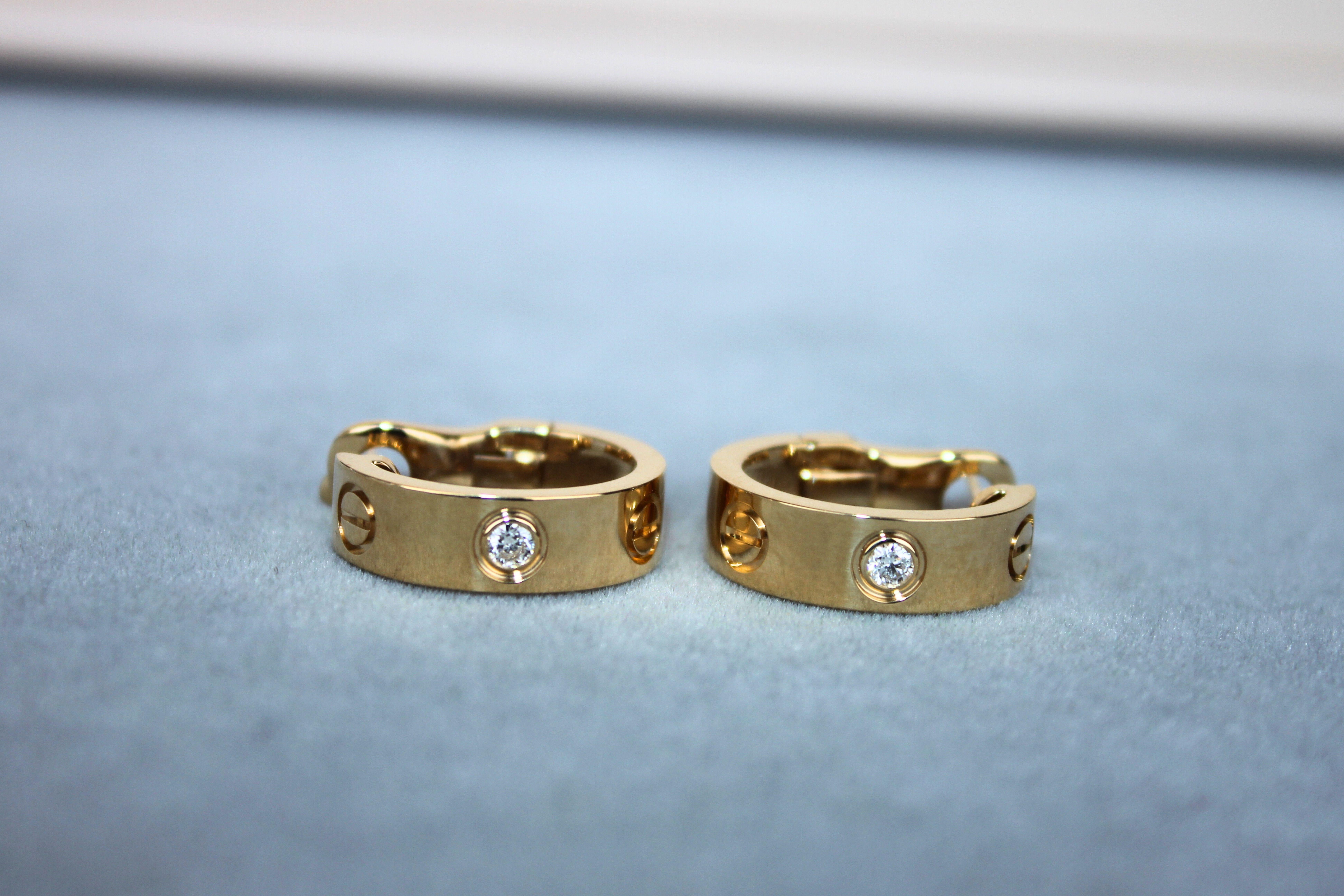 Modern Cartier Pre-Owned Love Diamond Bezel 18 Karat Yellow Gold Huggie Hoop Earrings For Sale