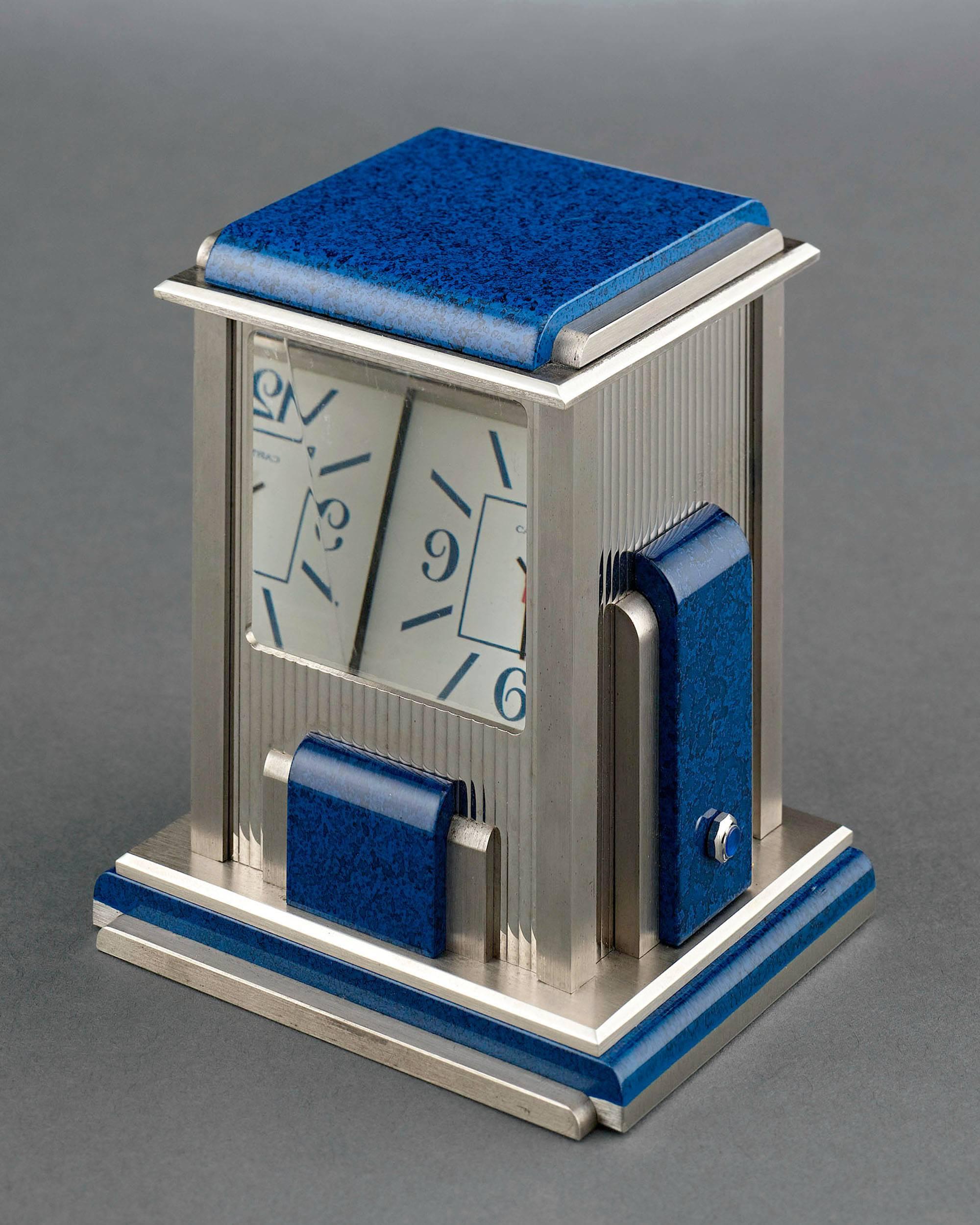 This mystery clock by Cartier, known as a “prism” clock, is a work of exceptional engineering and stylish artistry. Crafted in a sleek Art Deco style with lapis lazuli accents, this prism clock is silver-plated and fitted with quartz crystal prisms