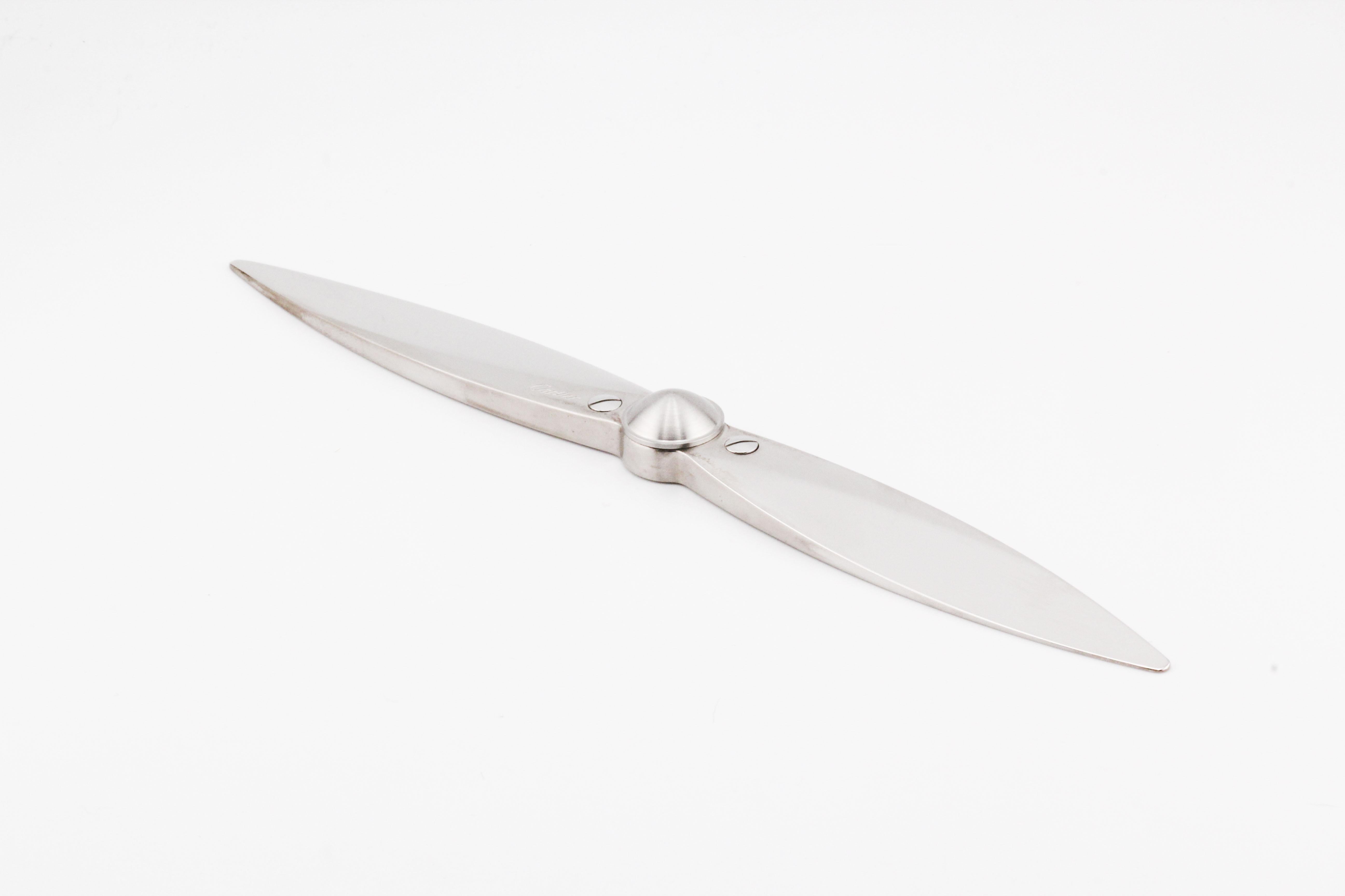 Unveil a new dimension of sophistication with the Cartier Propeller Letter Opener, an extraordinary blend of functionality and artistry. Crafted with precision and finesse, this letter opener is a testament to Cartier's legacy of creating