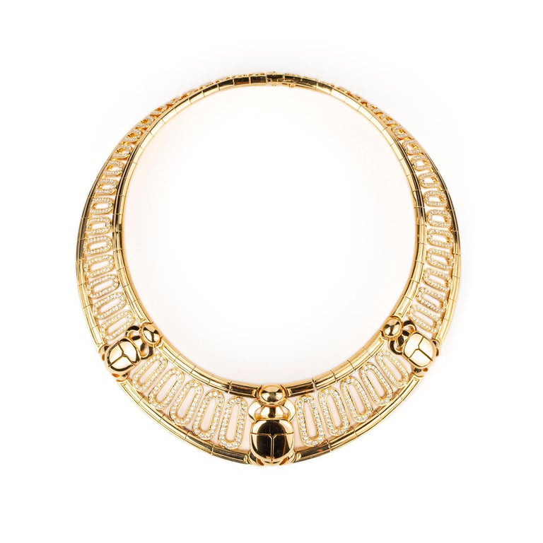 A Rare Egyptian Revival Cartier 18k Yellow Gold and Diamond Scarab Set (Necklace and Bracelet). Made in France, circa 1985. 

Diamonds F/G Color, VVS Clarity 
35cts total (20cts necklace, 15cts in bracelet). 
Necklace 14.5 inches
Bracelet 6.5 inches