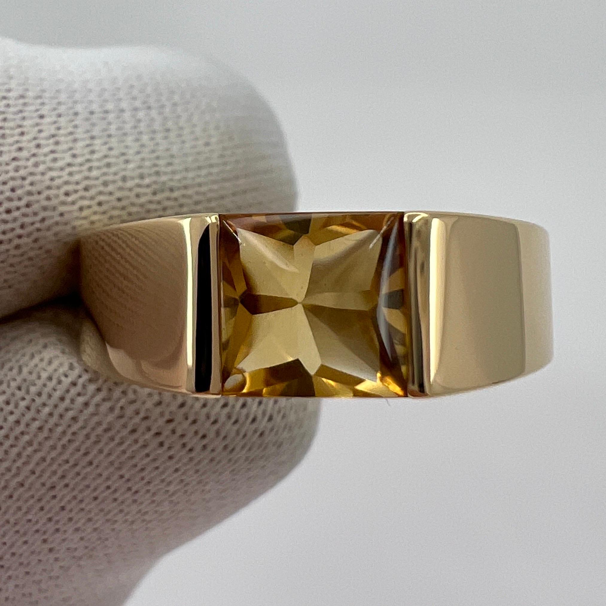 Cartier Vivid Yellow Citrine 18k Yellow Gold Tank Ring.

Stunning yellow gold ring with a 6mm tension set vivid yellow citrine. Fine jewellery houses like Cartier only use the finest of gemstones and this citrine is no exception. A top grade peridot