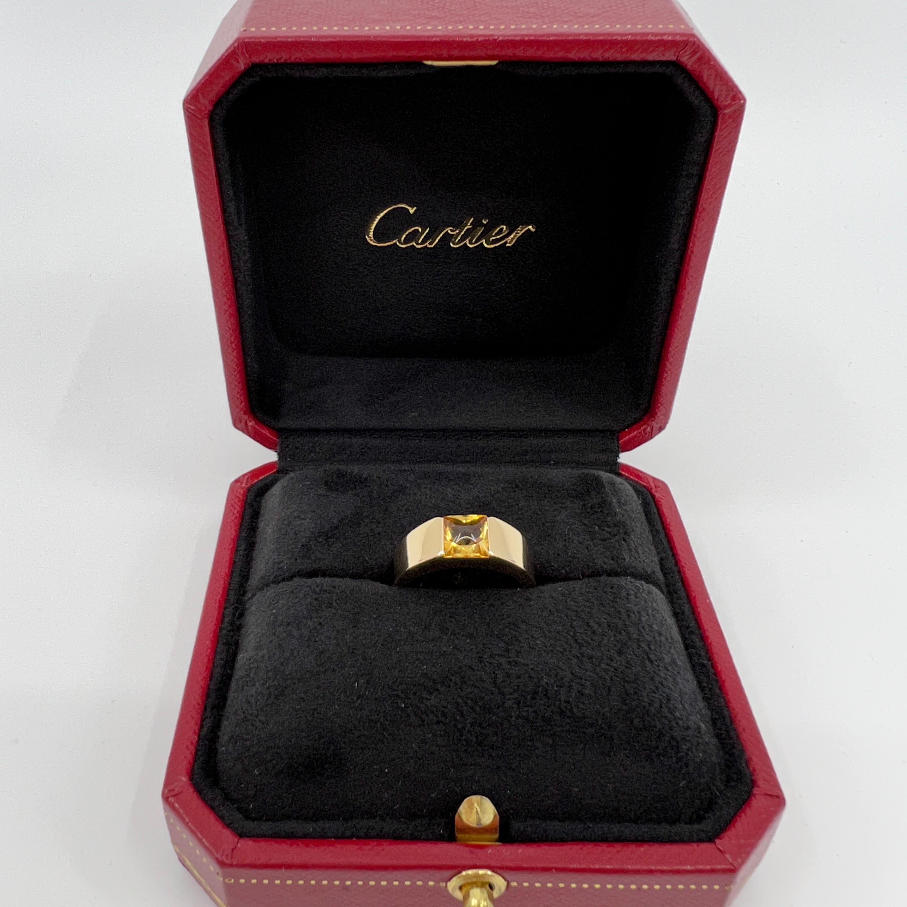 Cartier Vivid Yellow Orange Citrine 18k Yellow Gold Tank Ring.

Stunning yellow gold ring with an 8mm tension set vivid yellow orange citrine. Fine jewellery houses like Cartier only use the finest of gemstones and this citrine is no exception. A