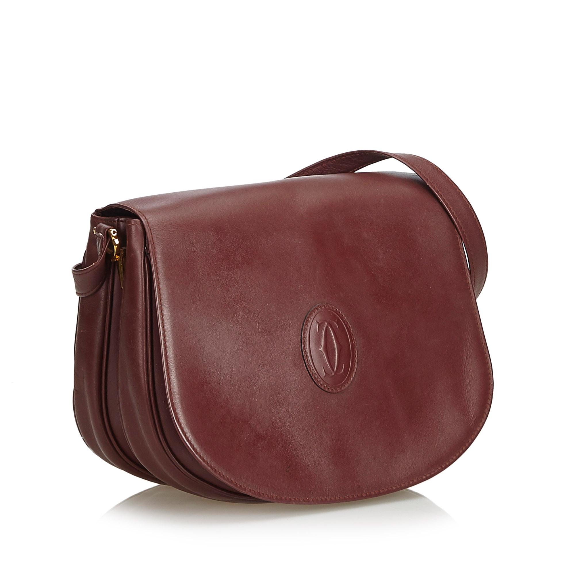 This crossbody bag features a leather body, a flat shoulder strap, a front flap with magnetic closure, and an interior zip pocket. It carries as B condition rating.

Inclusions: 
This item does not come with inclusions.

Dimensions:
Length: 21.00